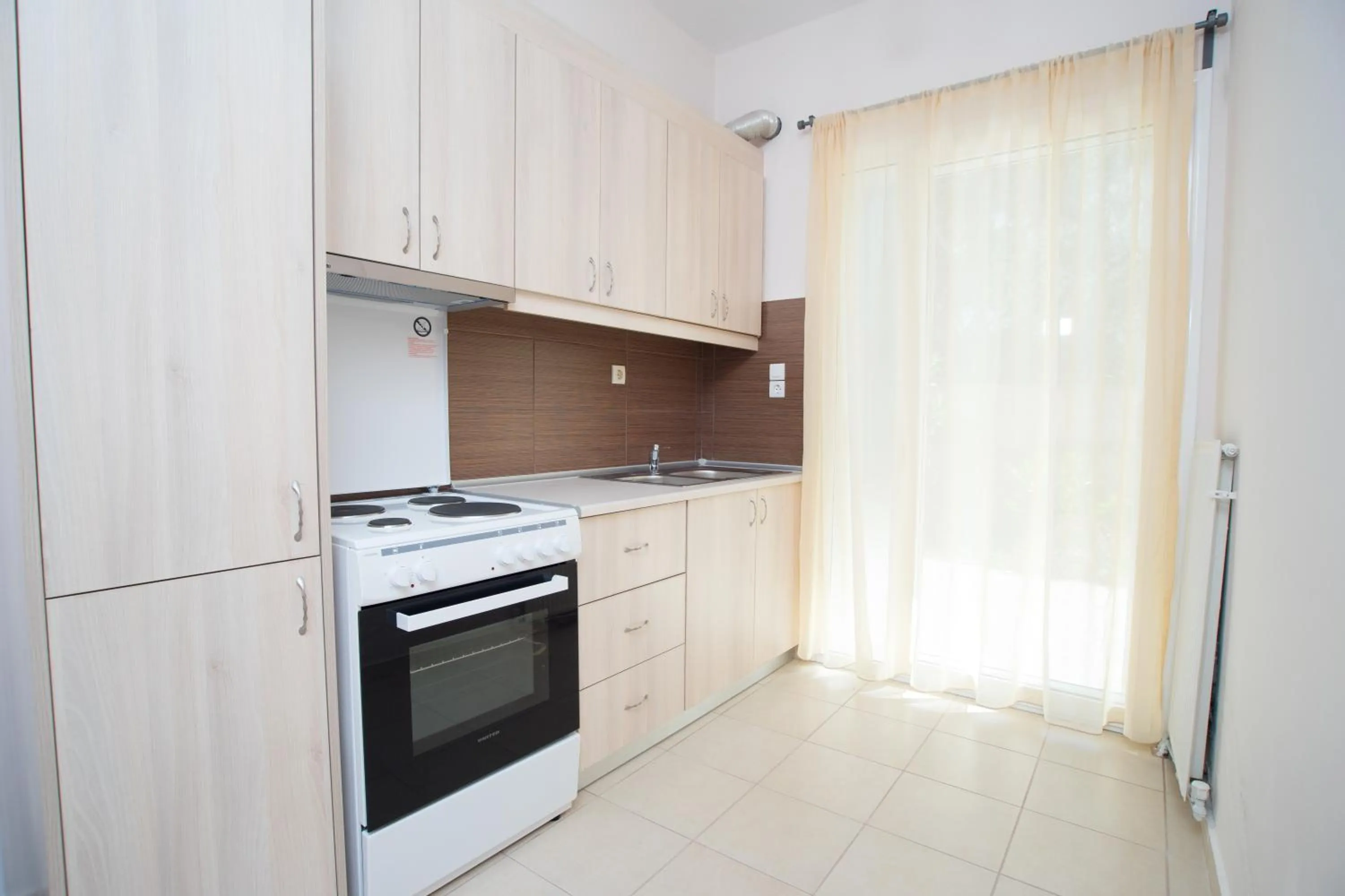 Kitchen or kitchenette in Naiades Luxury Apartments