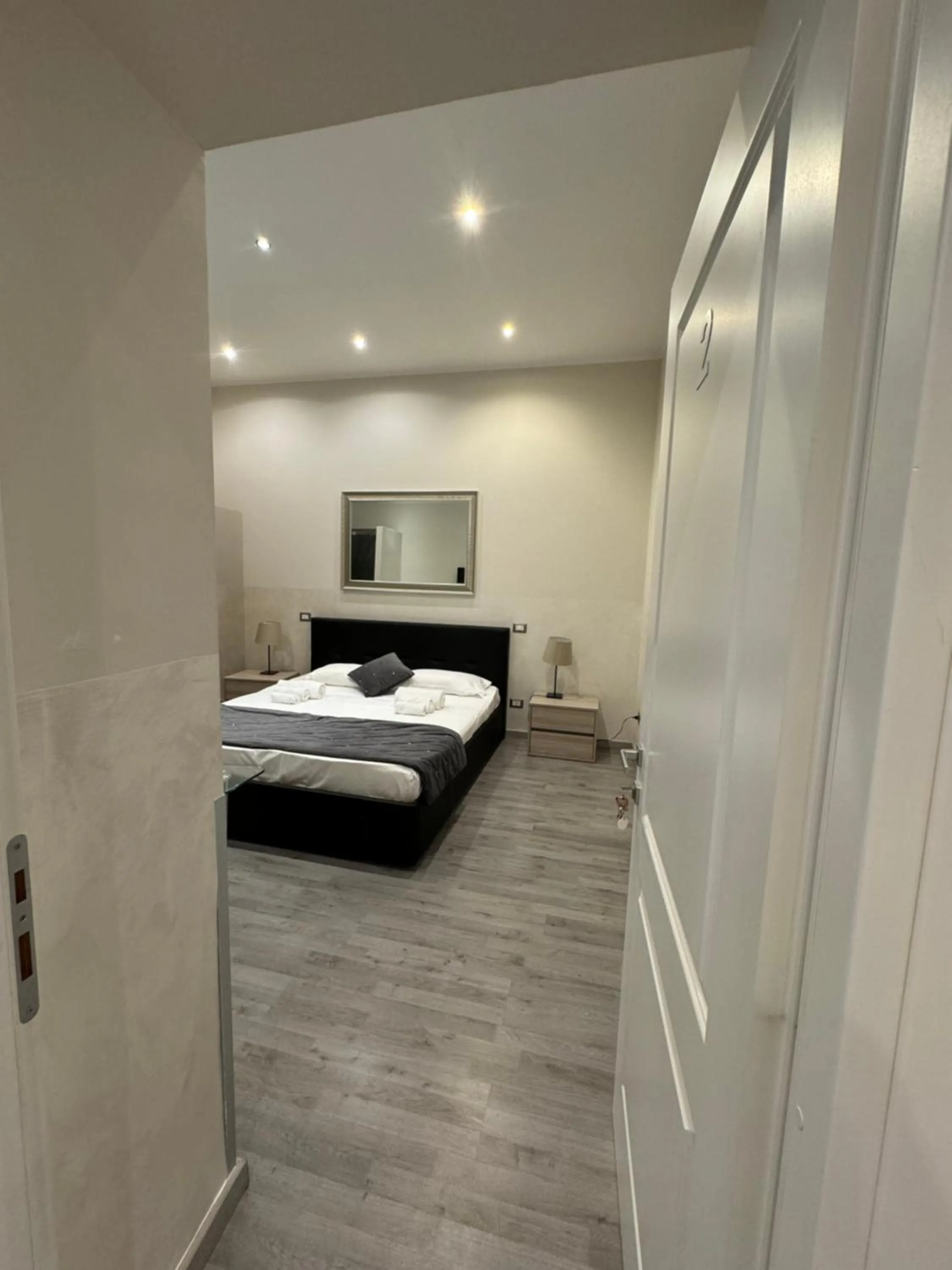 Photo of the whole room, Bed in RHS Rienzo Suites