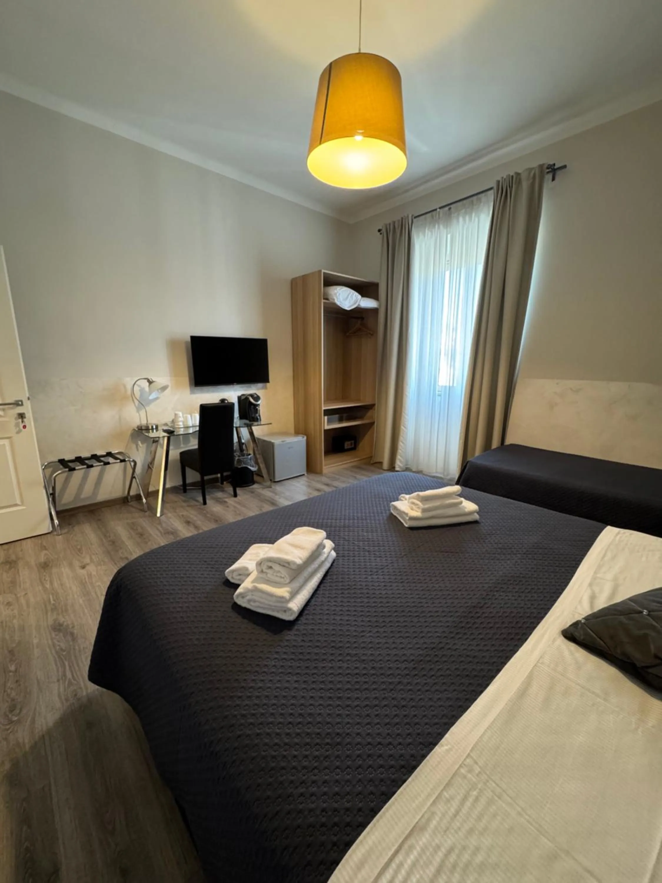 Bed in RHS Rienzo Suites