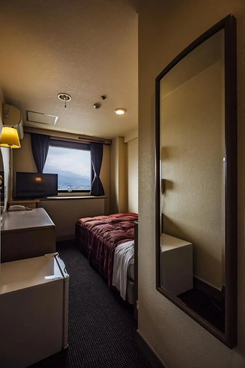 Bed in Asahi Century Hotel