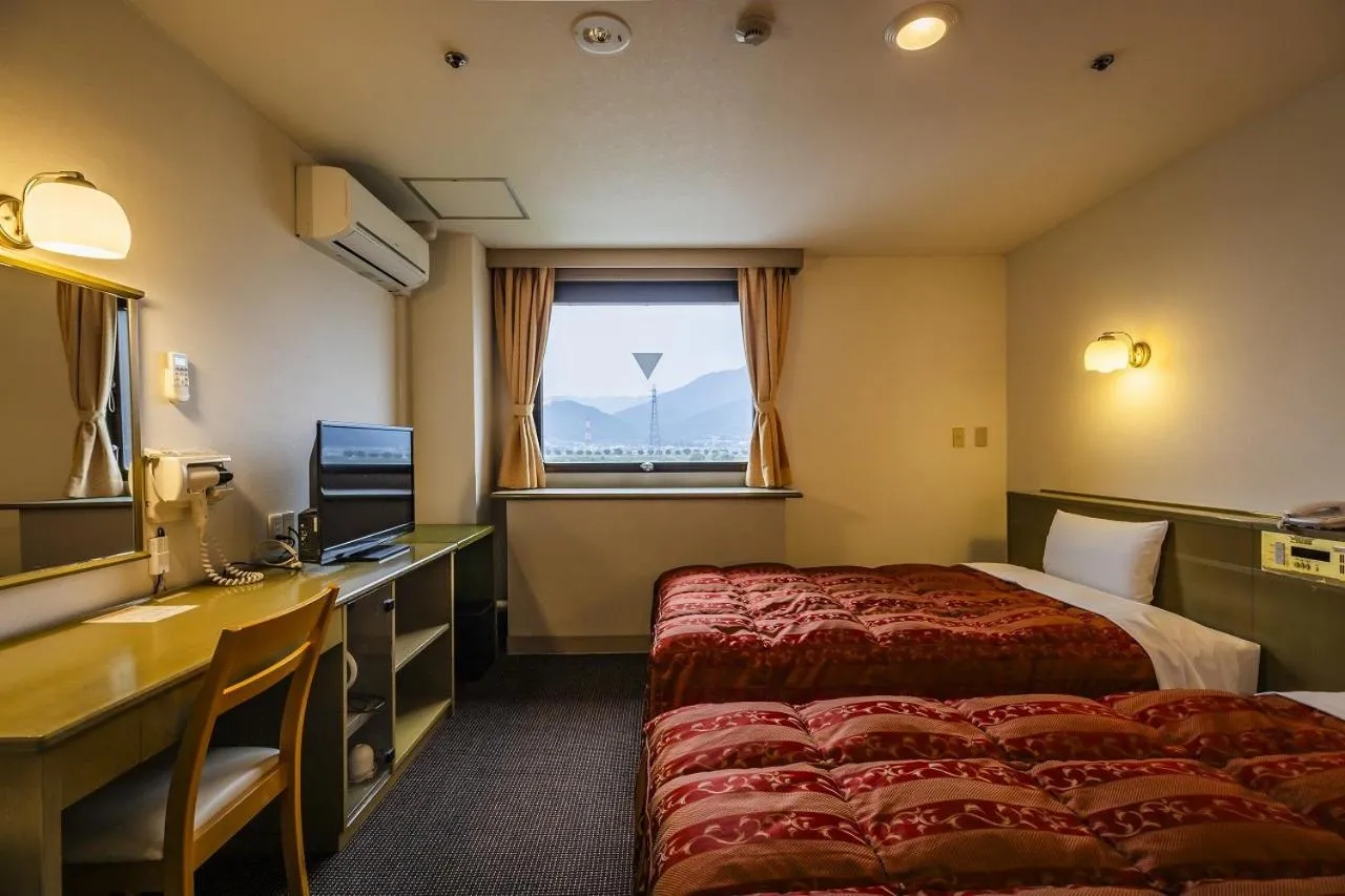 Bed in Asahi Century Hotel