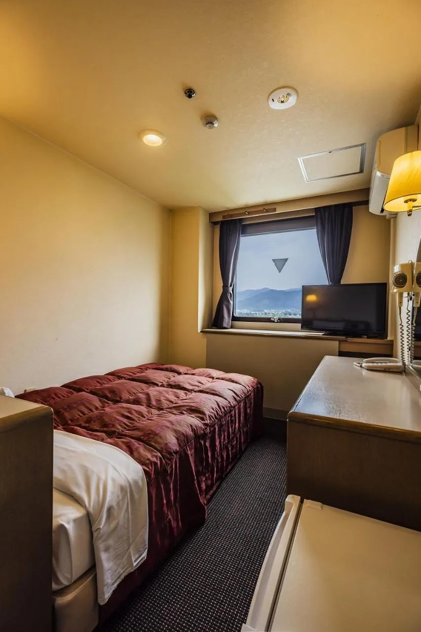 Bed in Asahi Century Hotel