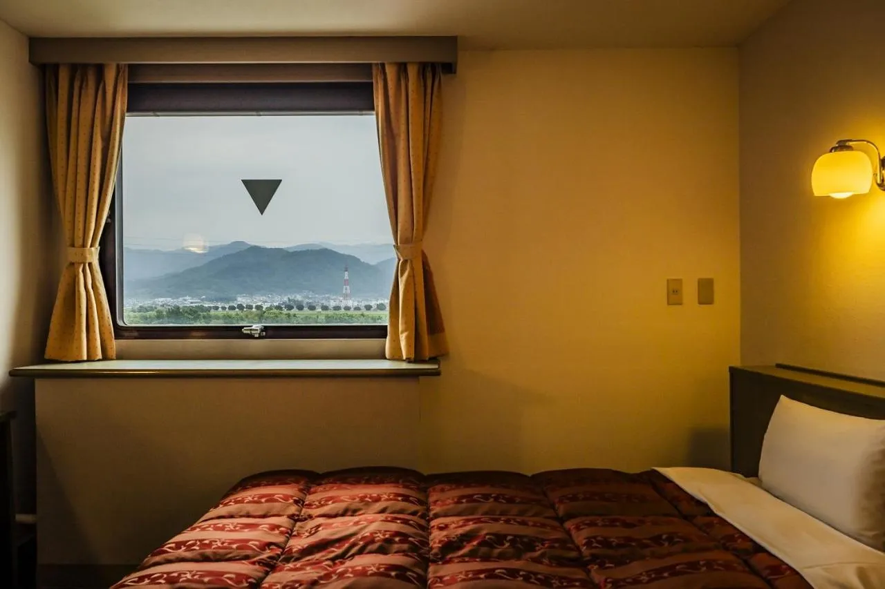 Bed in Asahi Century Hotel