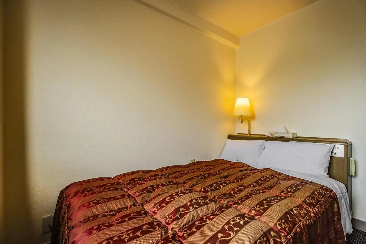 Bed in Asahi Century Hotel