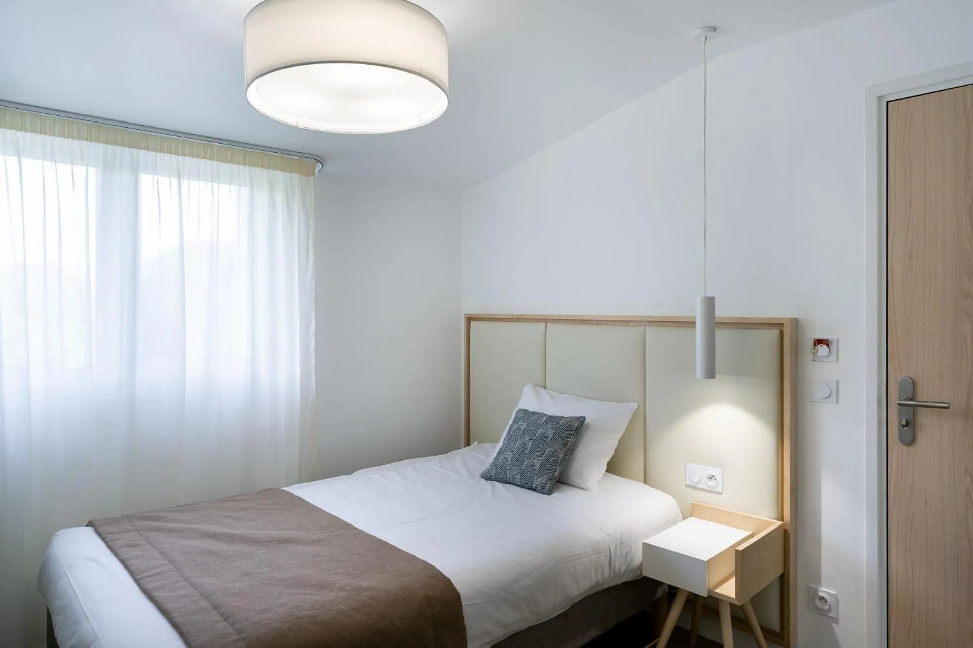 Bed in Hôtel Miléade Les Pléïades La Baule