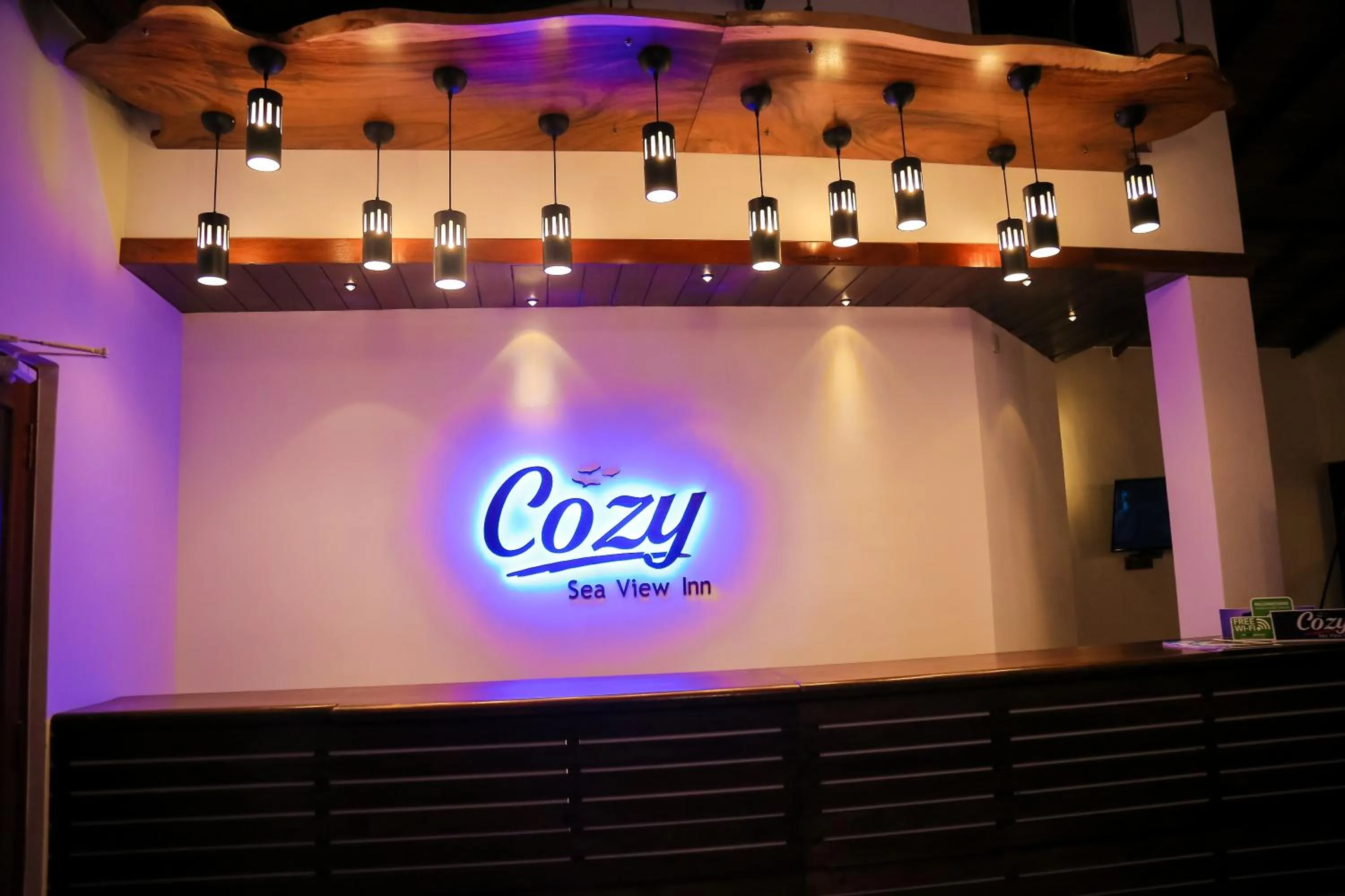 Property logo or sign in Cozy Sea view Inn