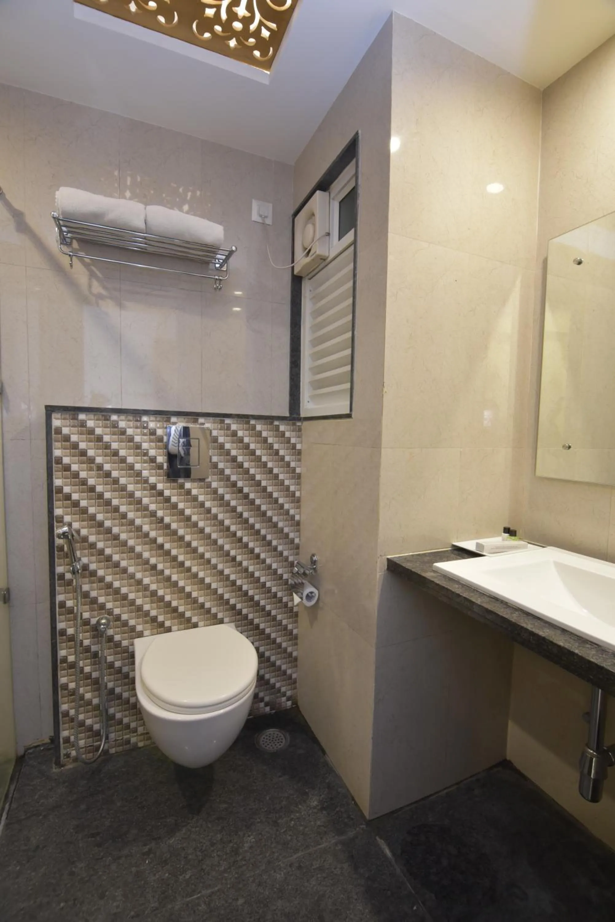 Toilet in I V Sanctum Hotel