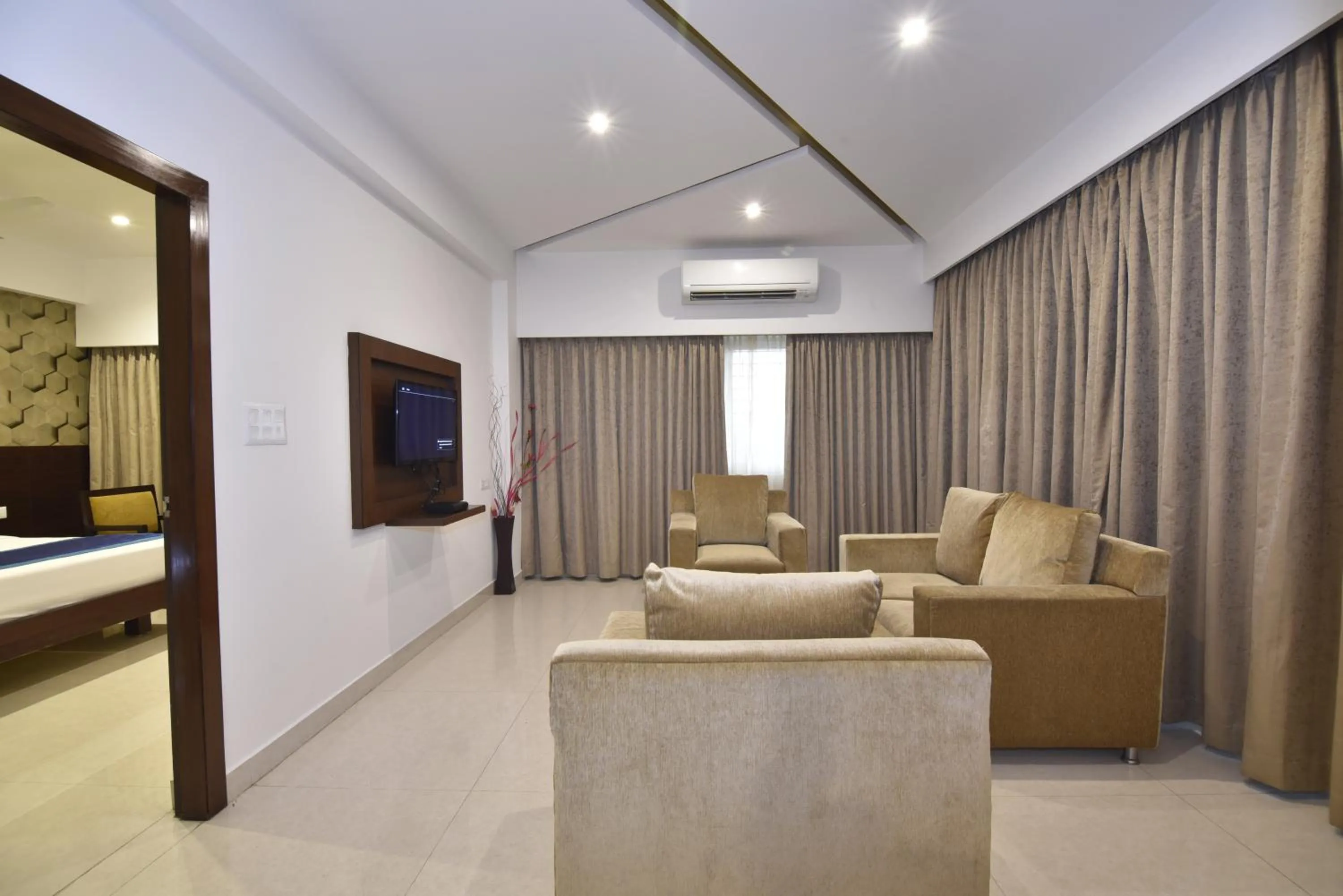 Living room, Bed in I V Sanctum Hotel