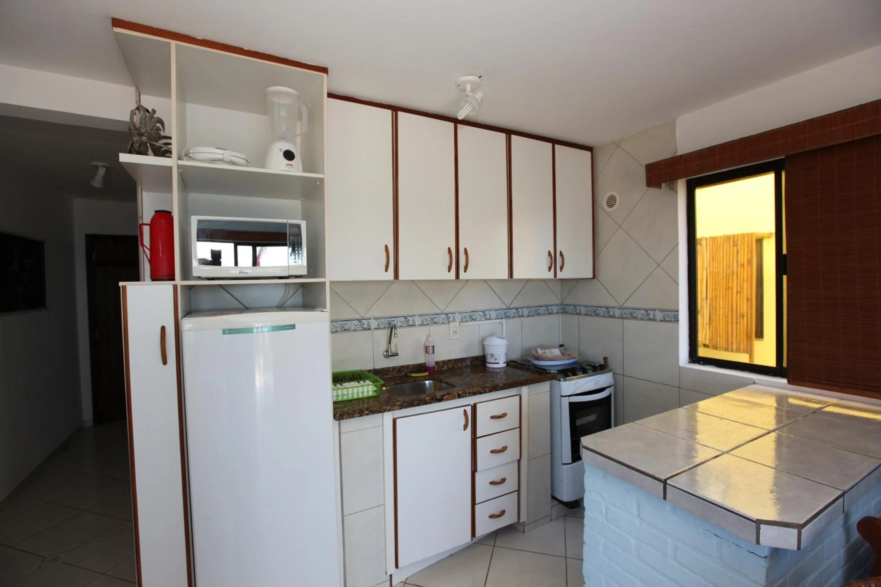 Kitchen or kitchenette in Pousada Hibisco