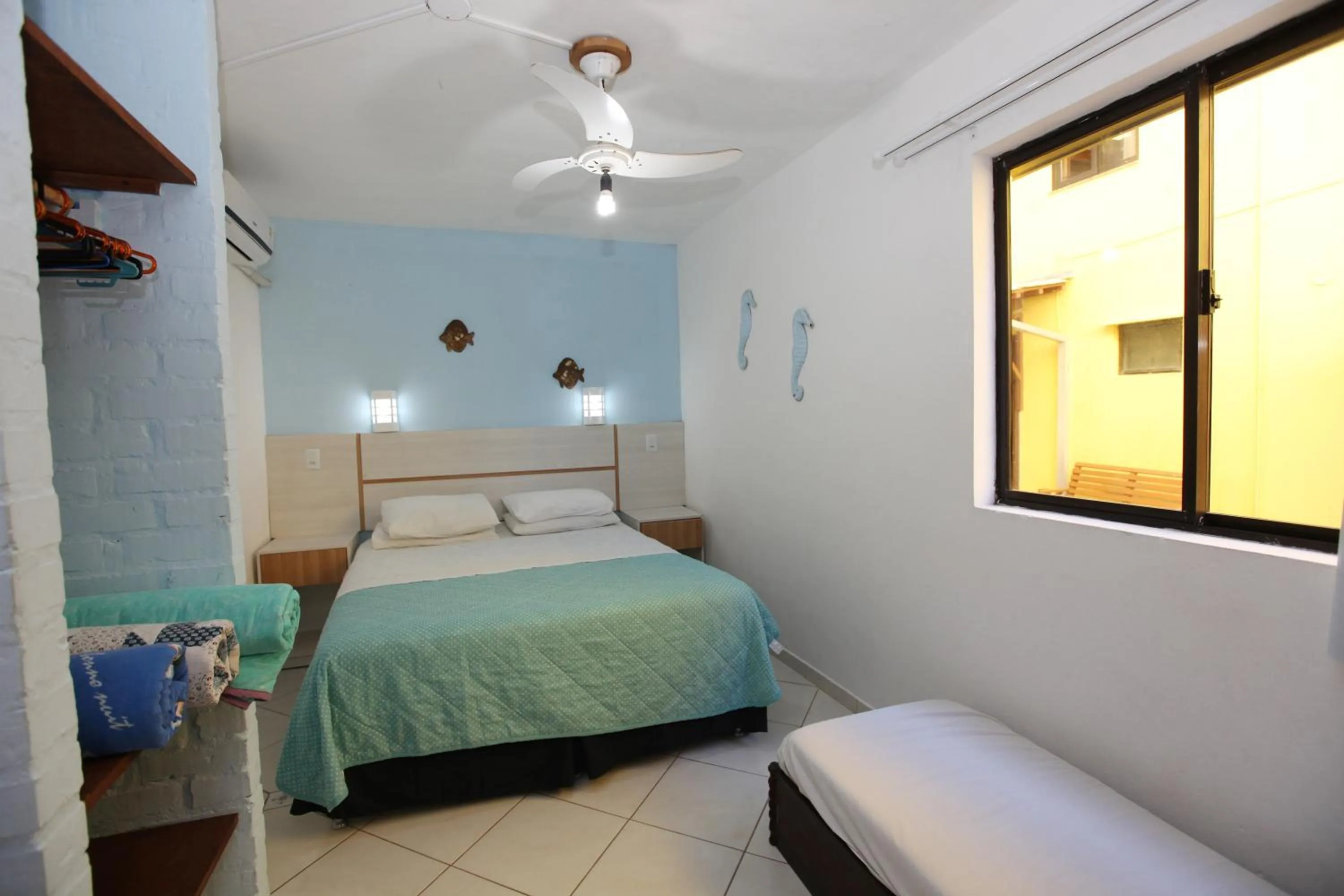 Bed in Pousada Hibisco