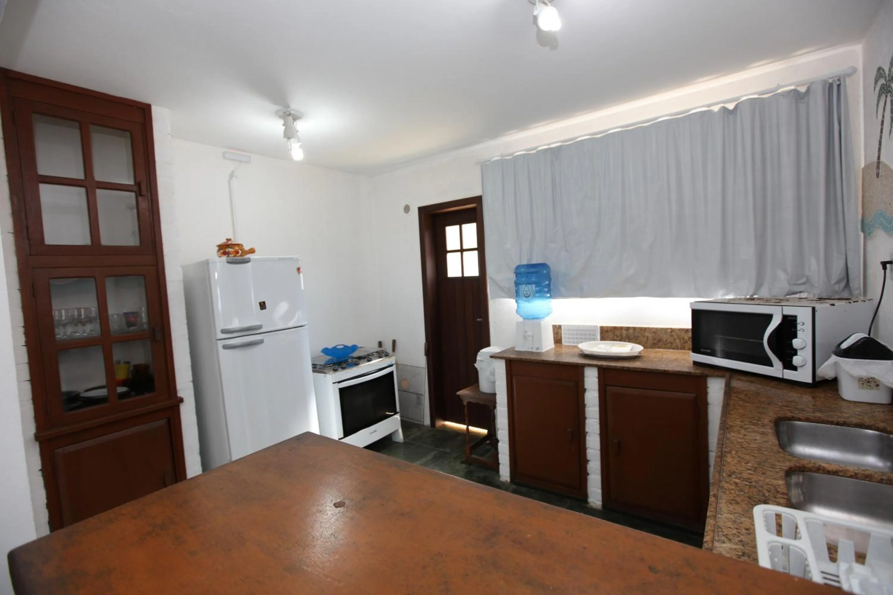 Kitchen or kitchenette in Pousada Hibisco