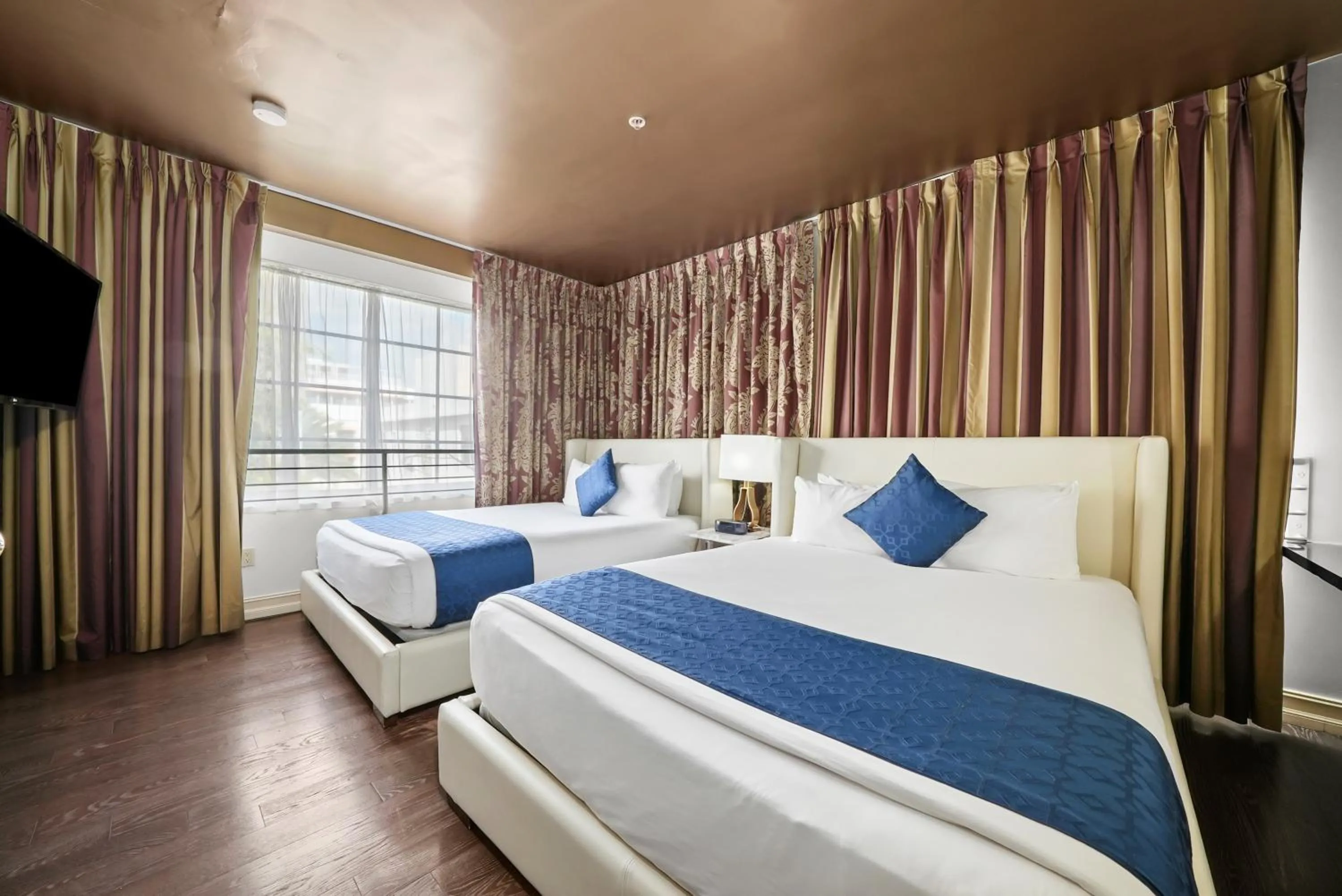 Bed in Riviera Suites