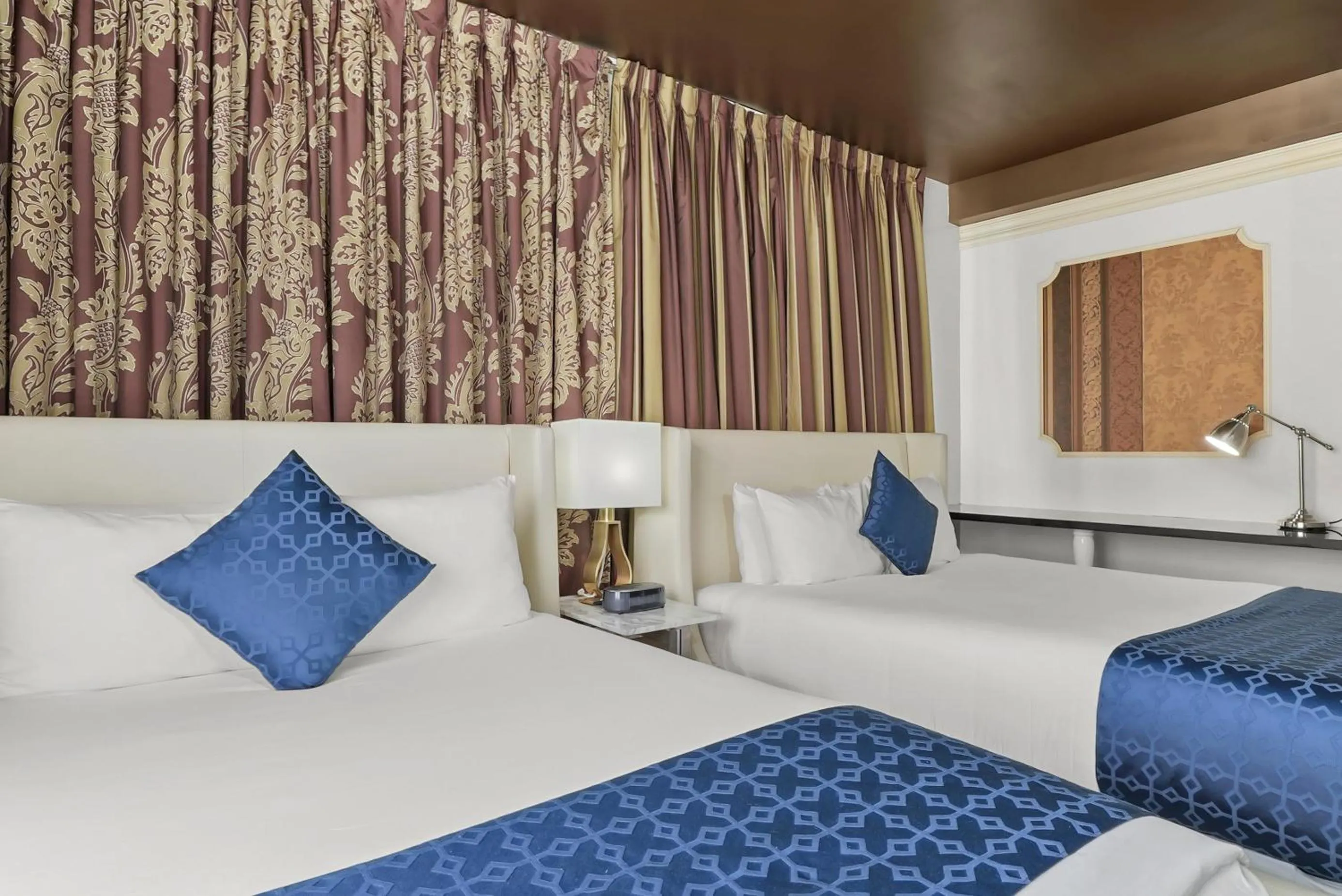 Bed in Riviera Suites