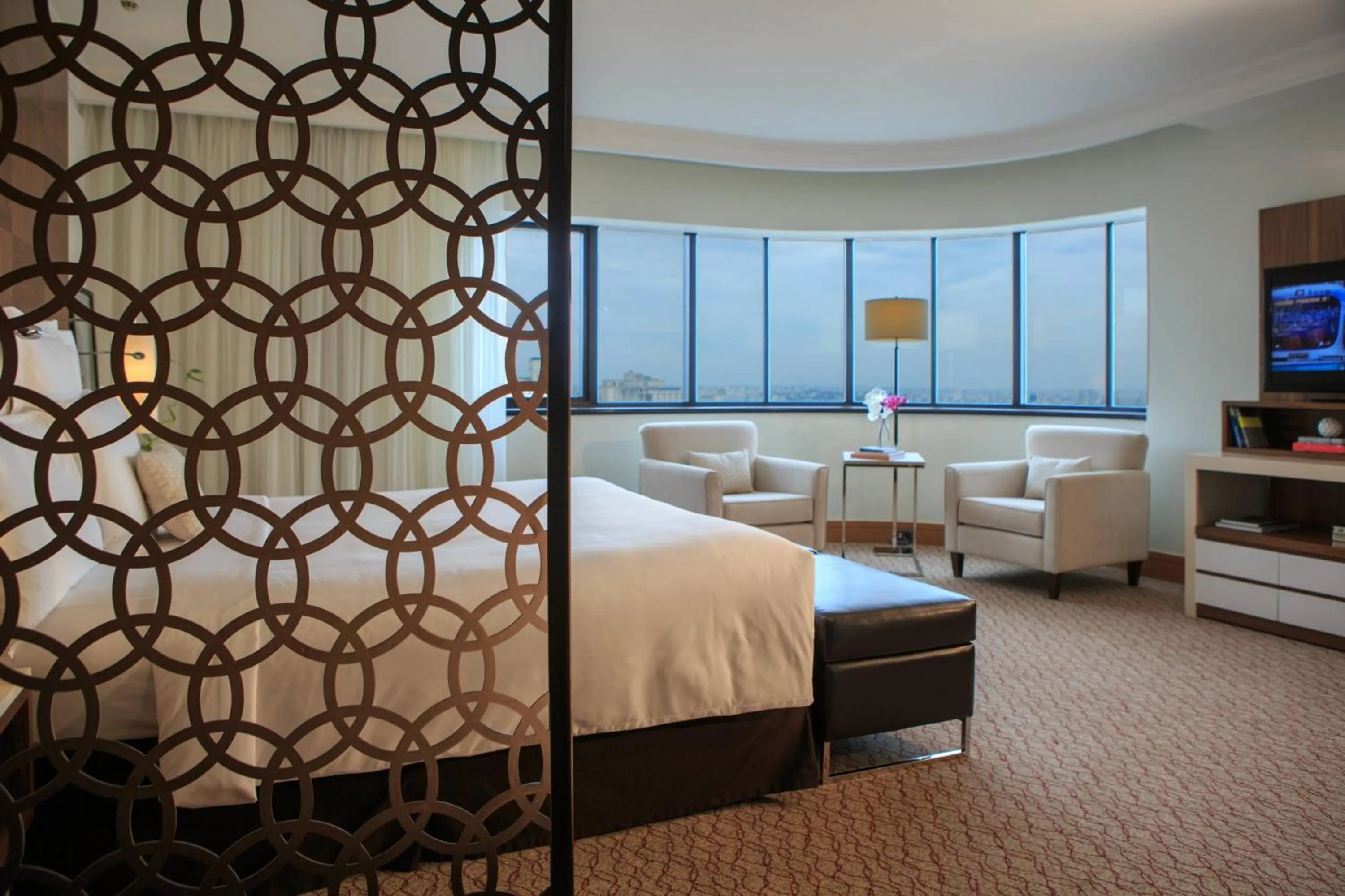 Living room, Bed in Renaissance São Paulo Hotel