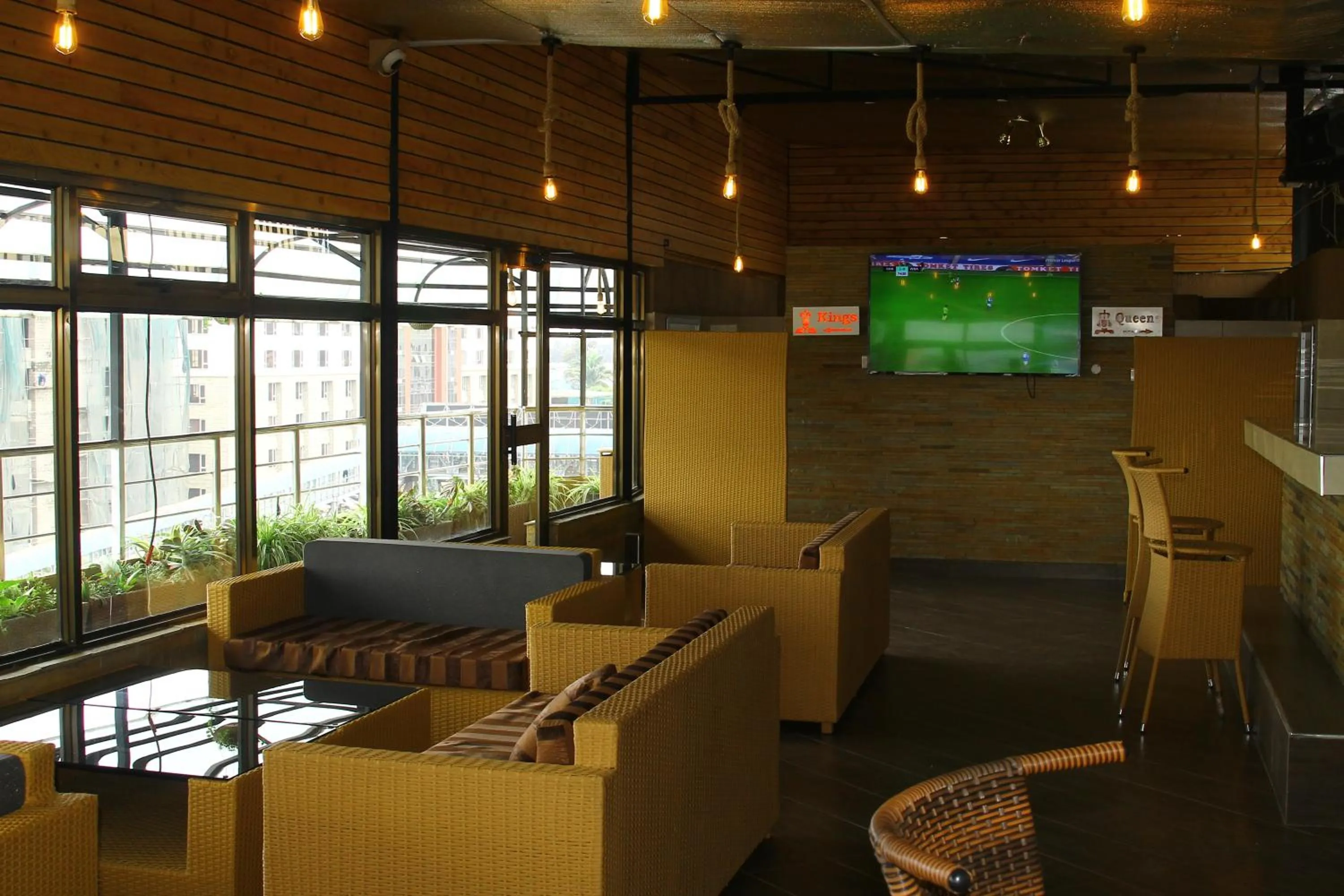 Communal lounge/ TV room in Airport Landing Hotel