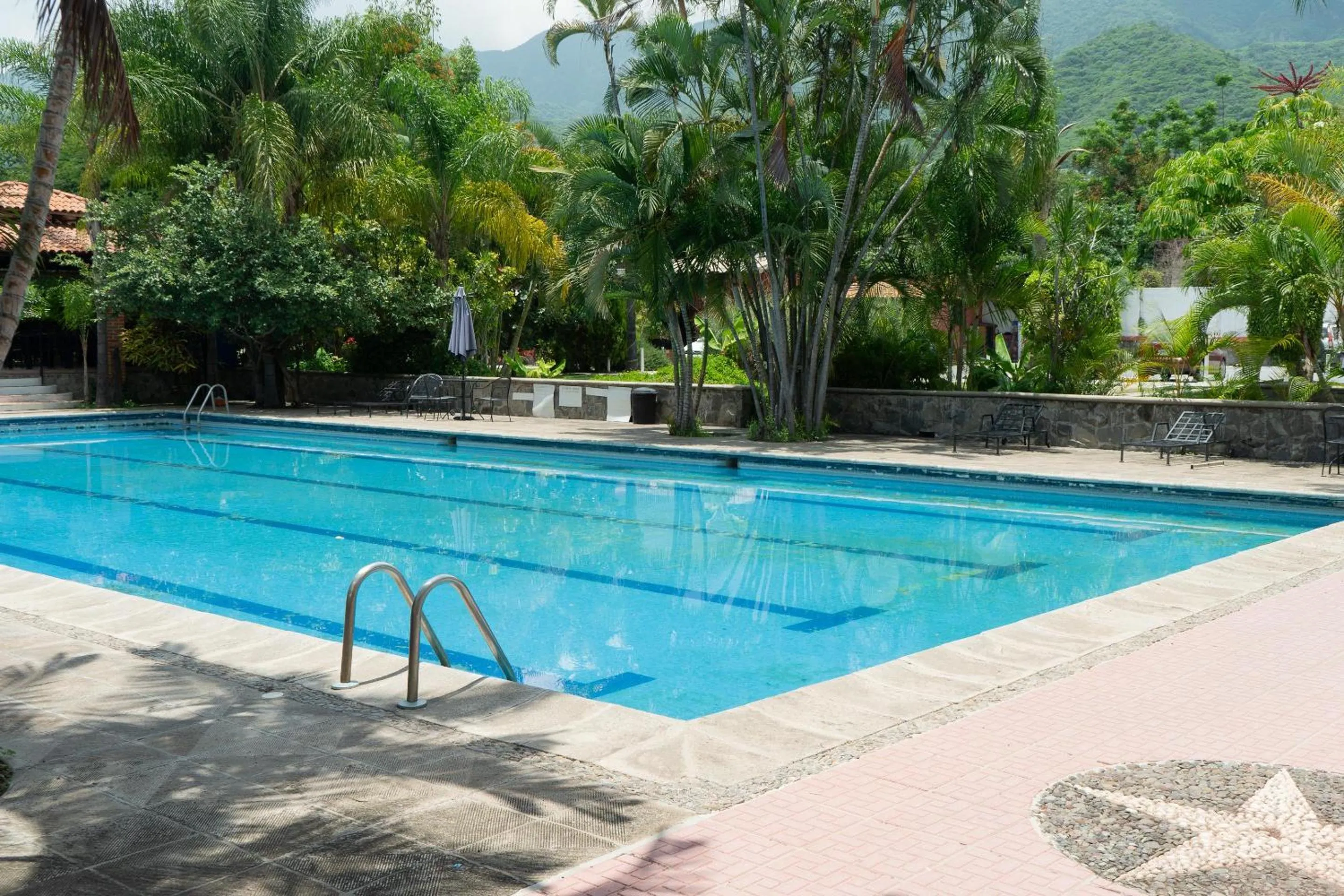 Swimming pool in Capital O La Joya Del Lago