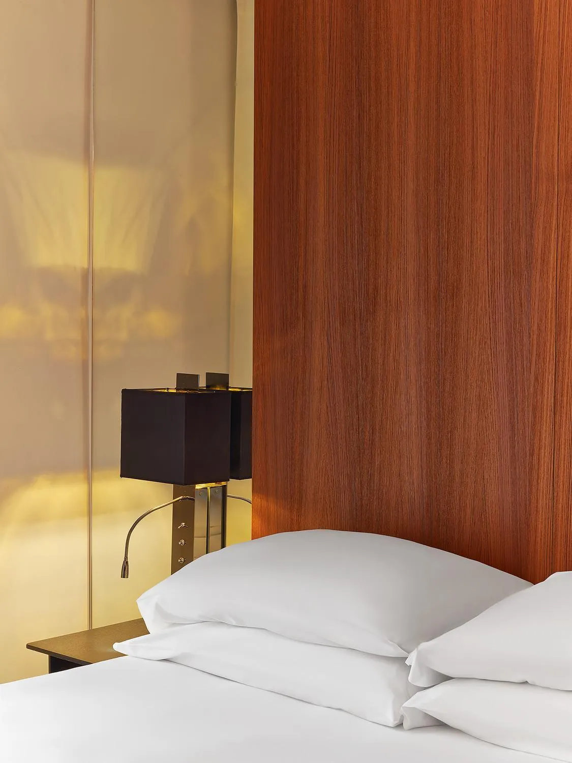 Bed in Le Metropolitan, Paris Tour Eiffel, a Tribute Portfolio Hotel