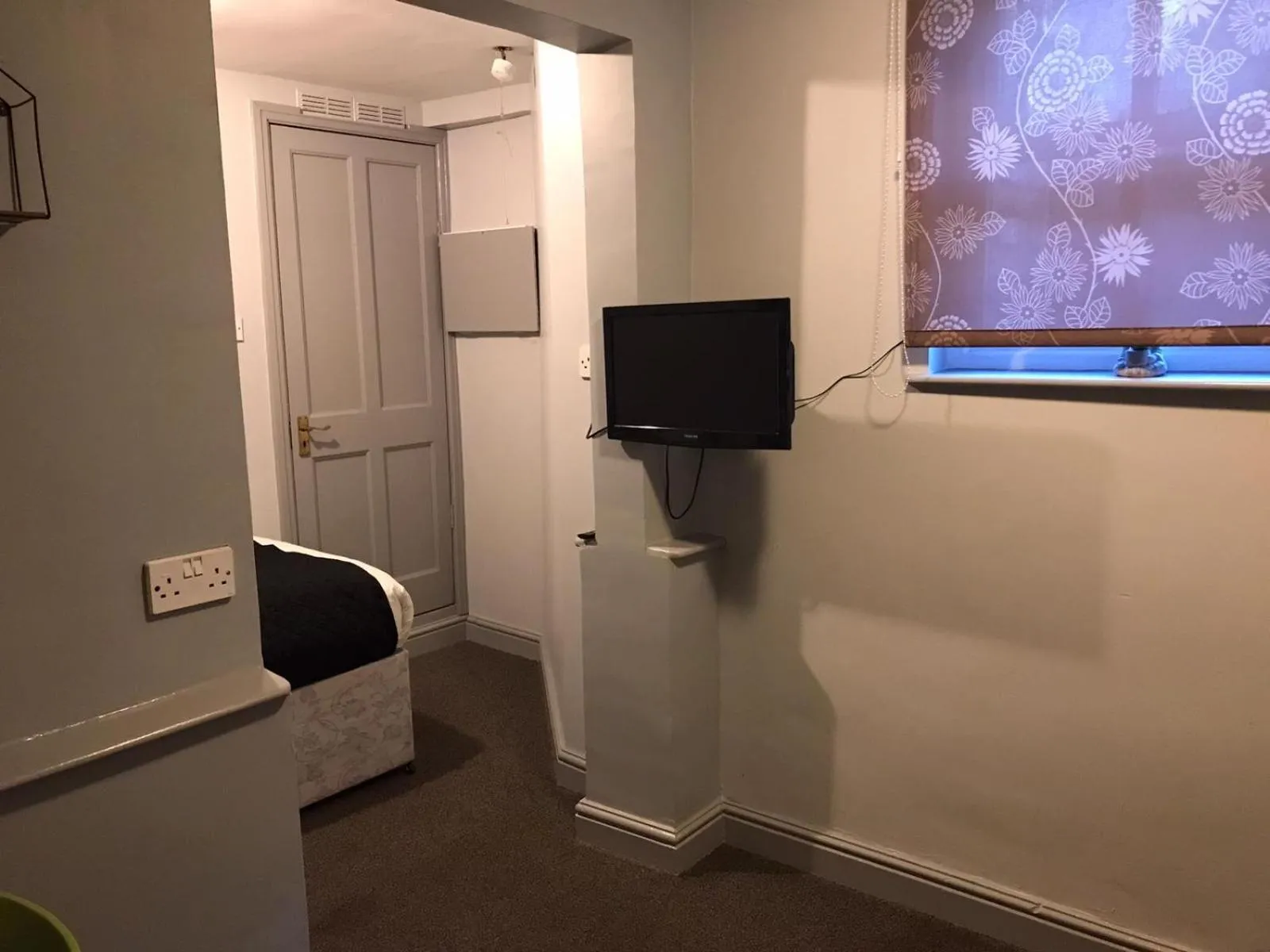 Bedroom in Queens Guesthouse Manchester