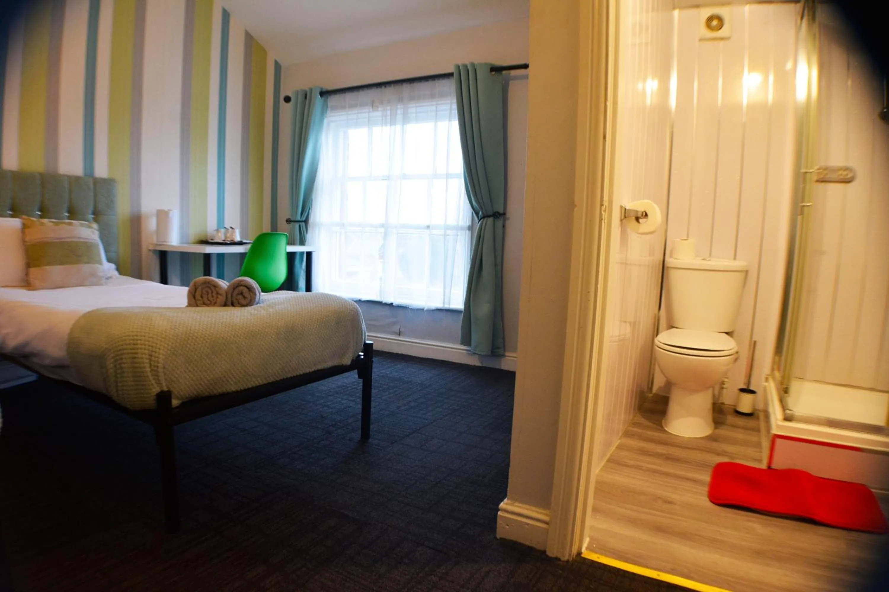 Bed in Queens Guesthouse Manchester