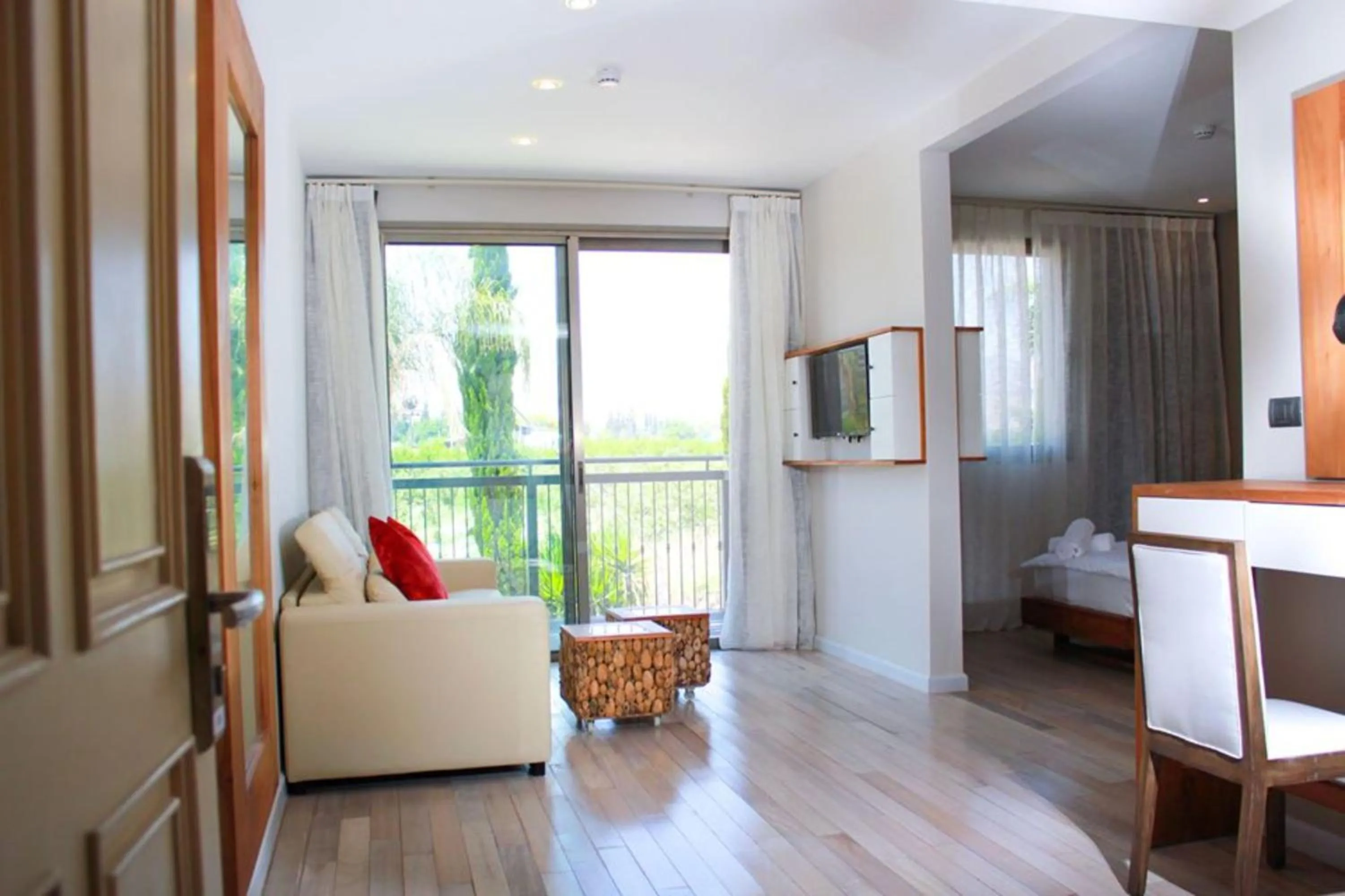 Seating area, Bed in Yarden Estate Hotel