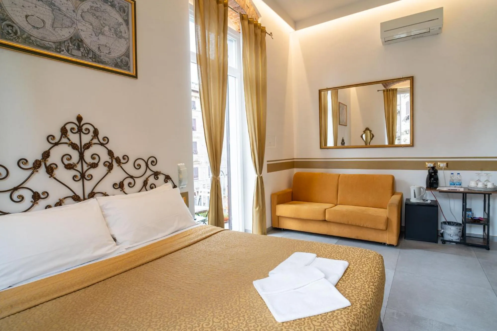 Bed in Teresa Rooms & Suites