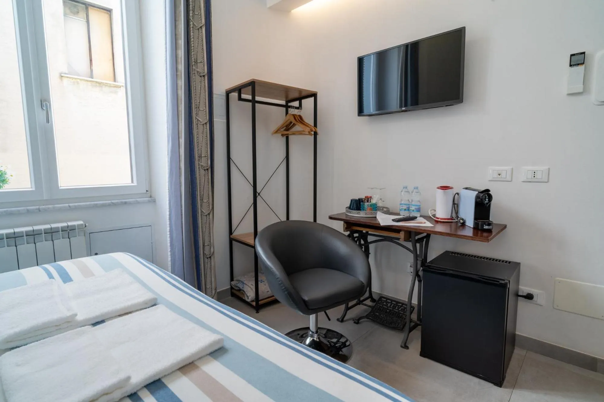 Bed in Teresa Rooms & Suites