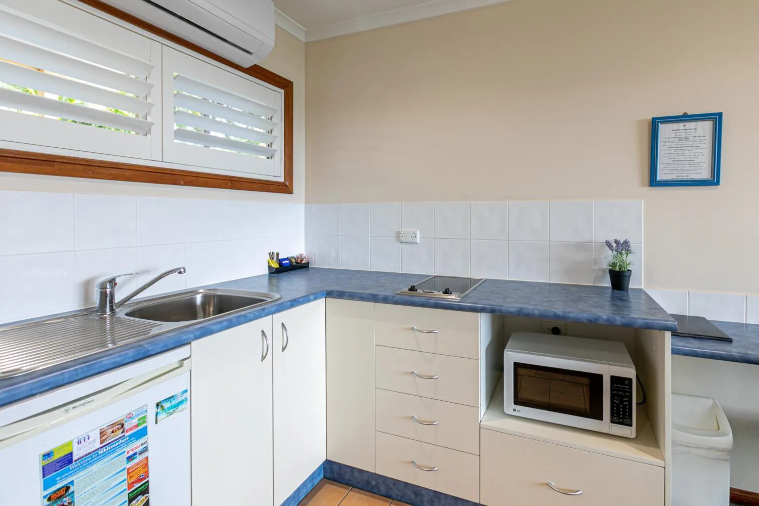 Kitchen or kitchenette in Sunlit Waters Studio Apartments