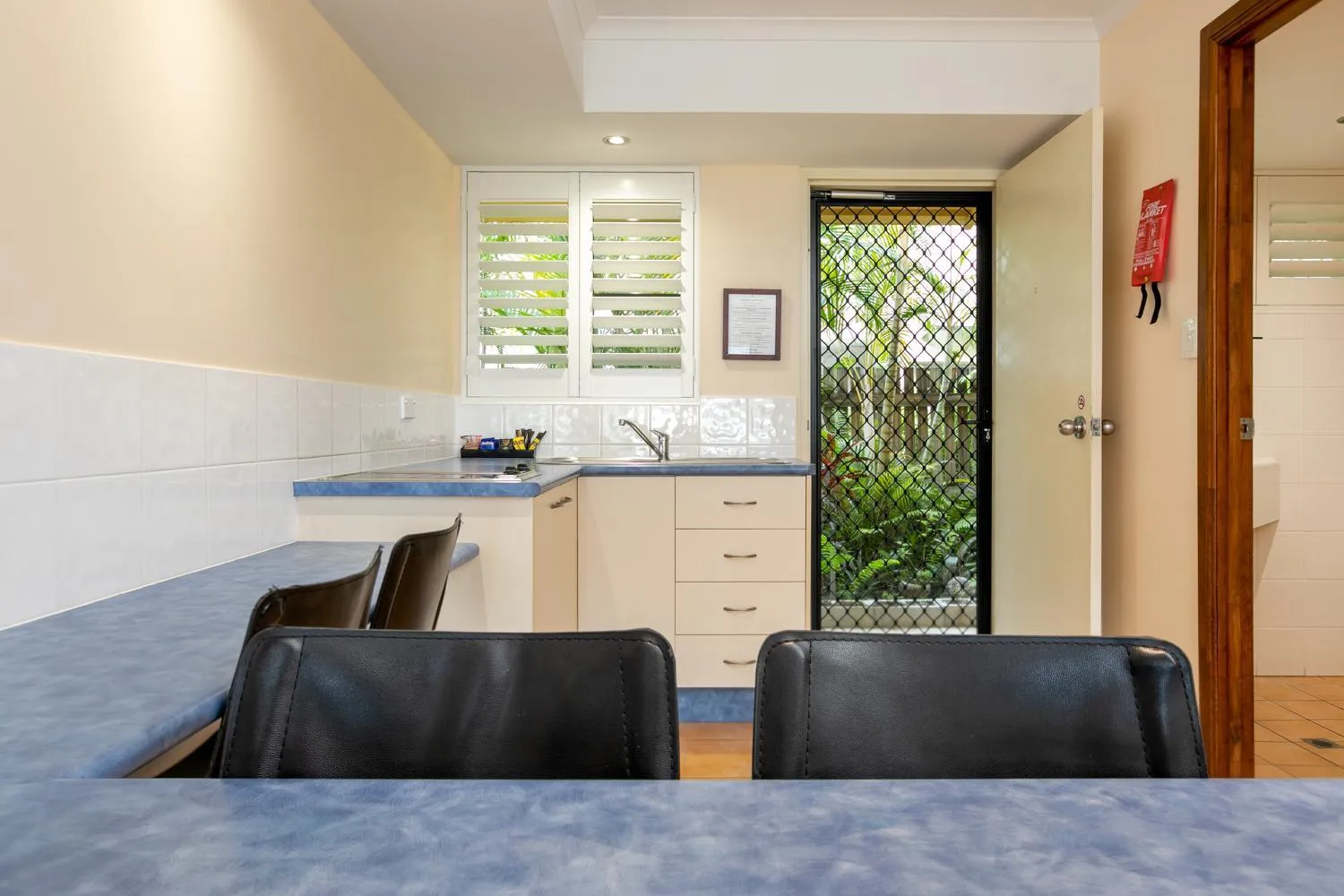 Kitchen or kitchenette in Sunlit Waters Studio Apartments