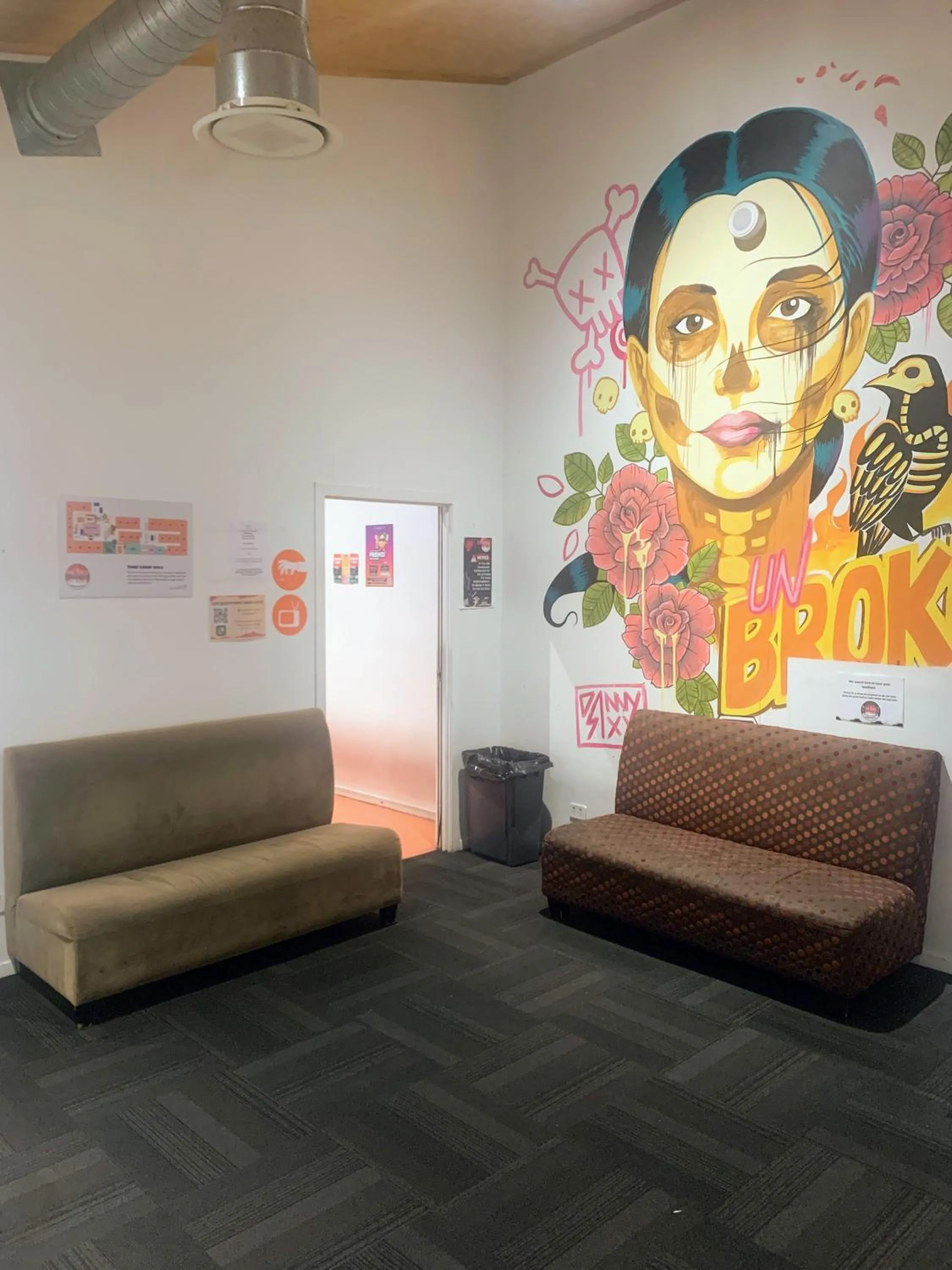 Communal lounge/ TV room in Metro Adventurer Backpackers