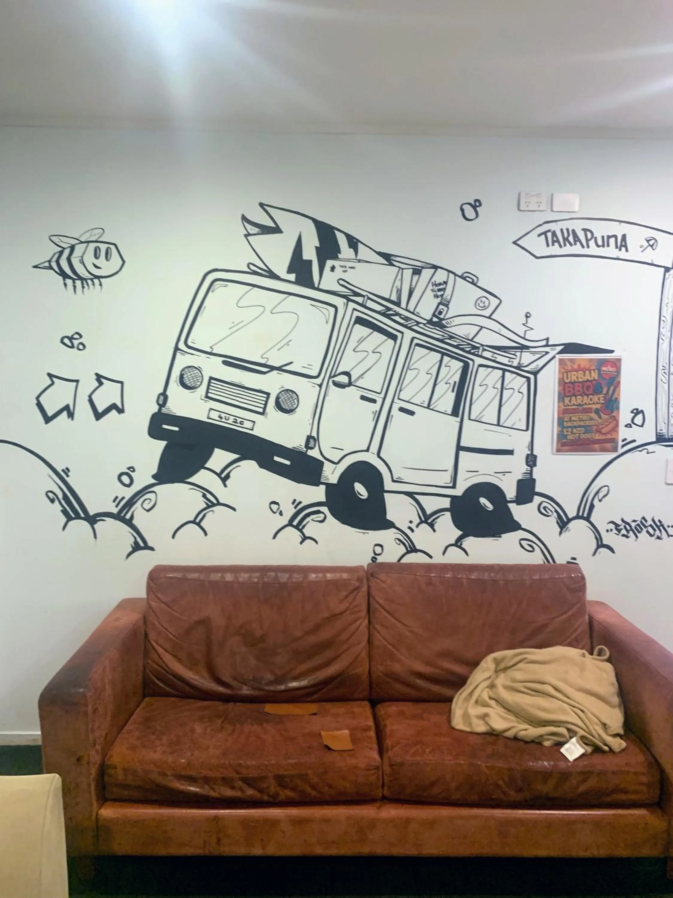 Communal lounge/ TV room in Metro Adventurer Backpackers