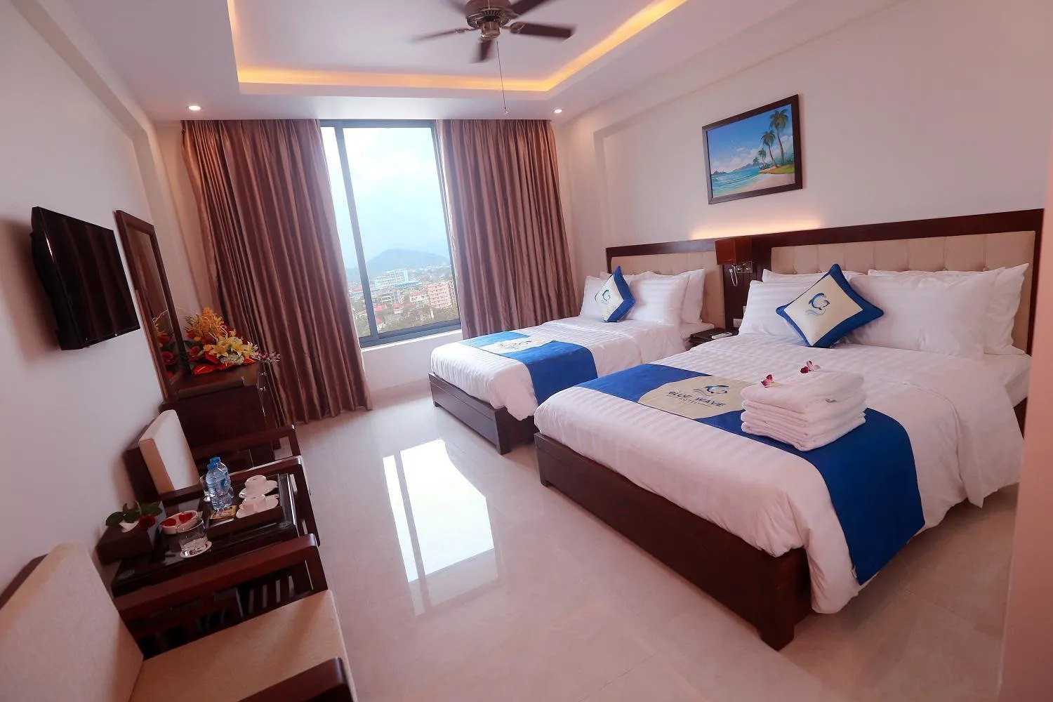 Bed in Blue Wave Hotel