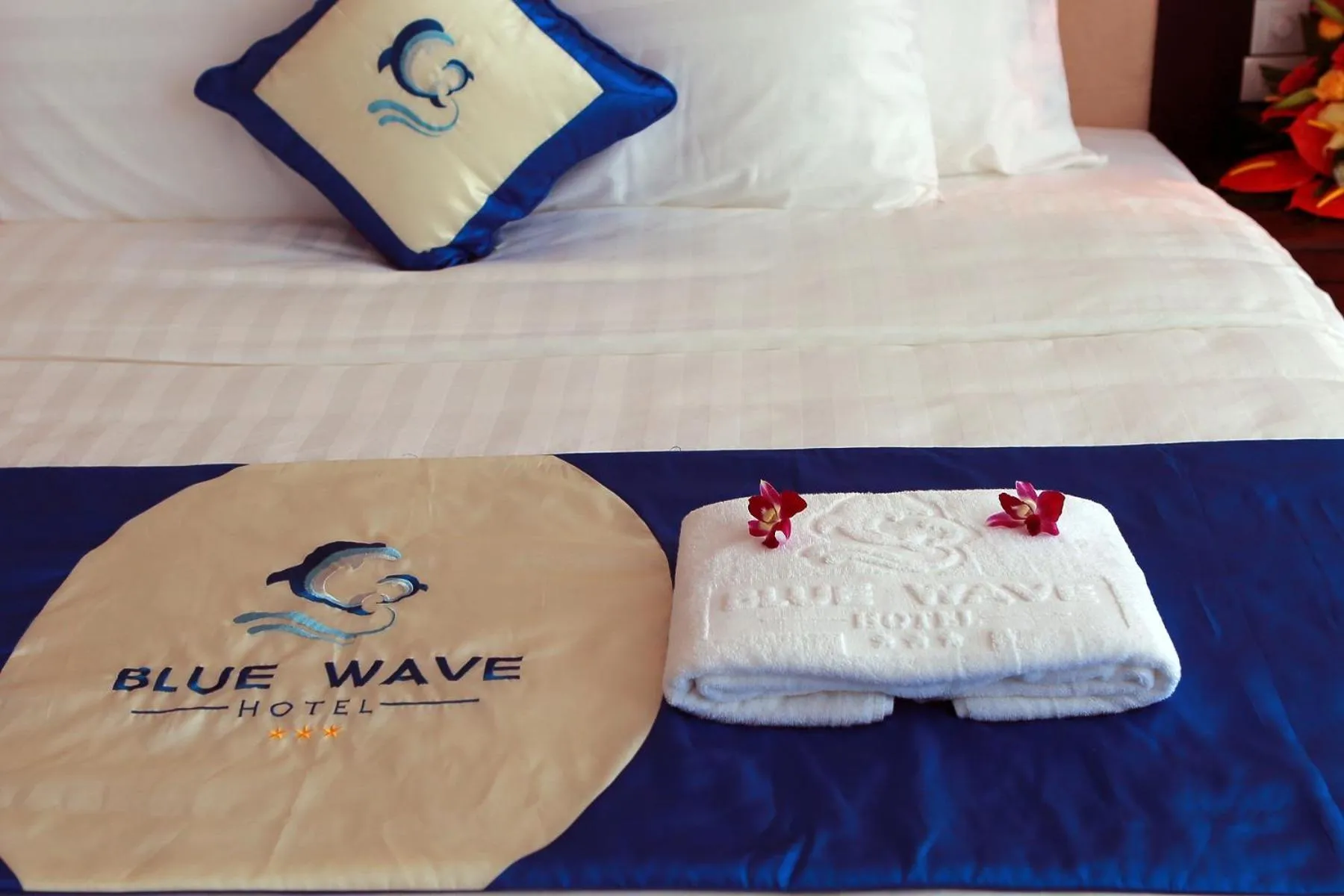 Bed in Blue Wave Hotel