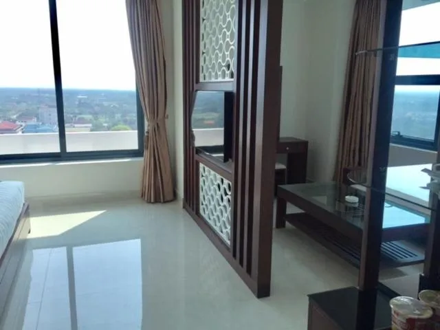 Bed in Blue Wave Hotel