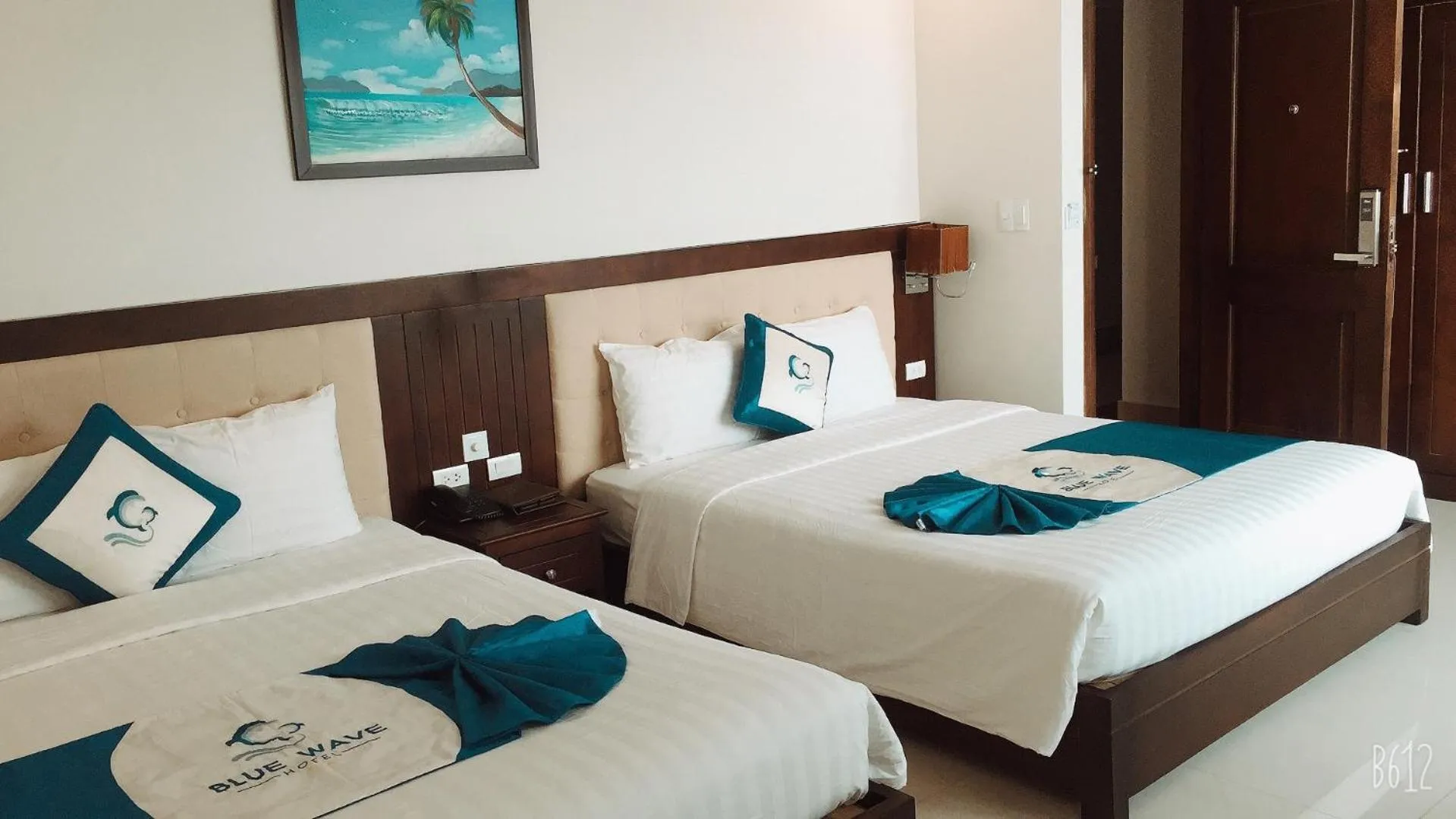 Bed in Blue Wave Hotel