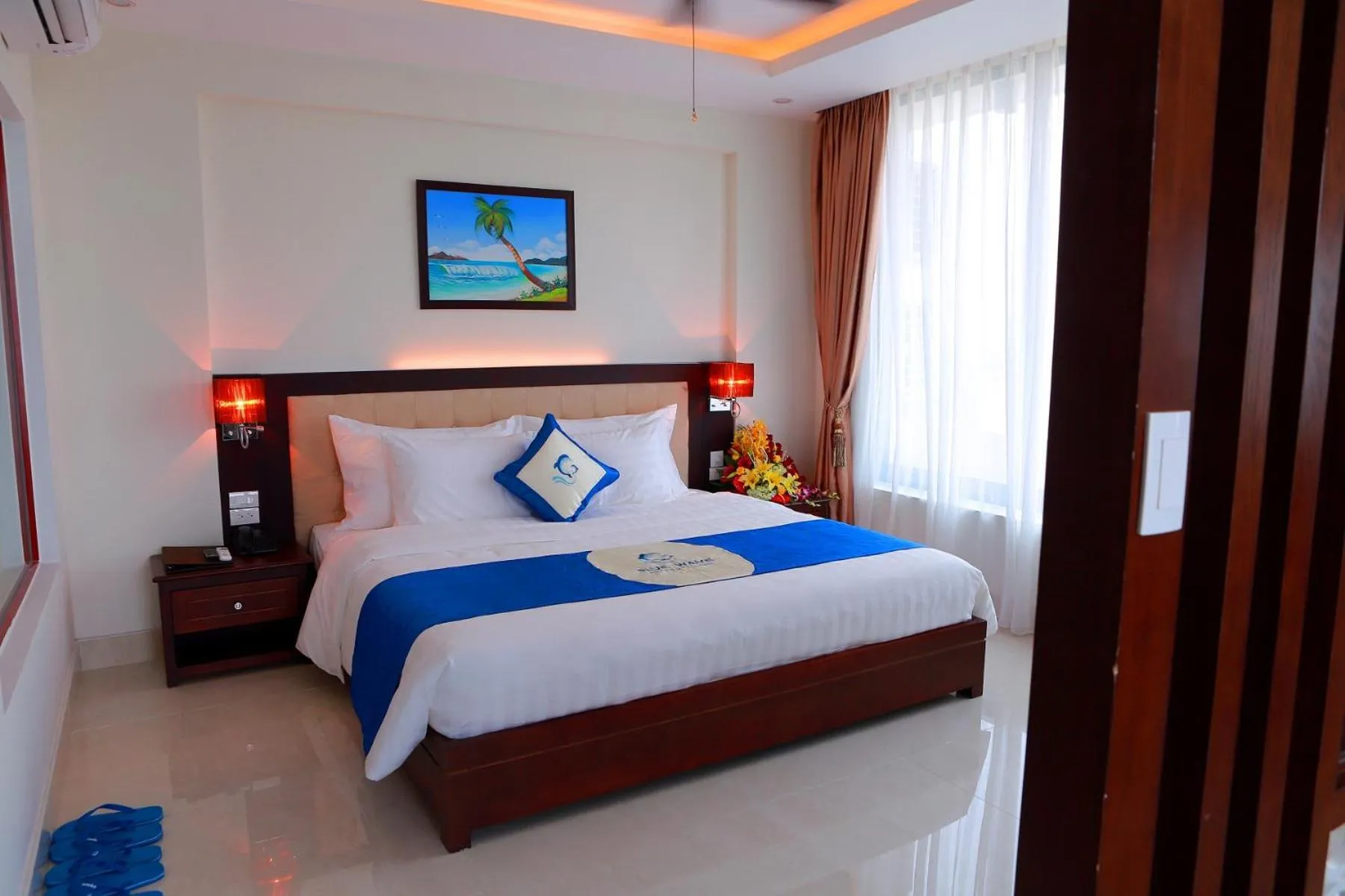 Bed in Blue Wave Hotel