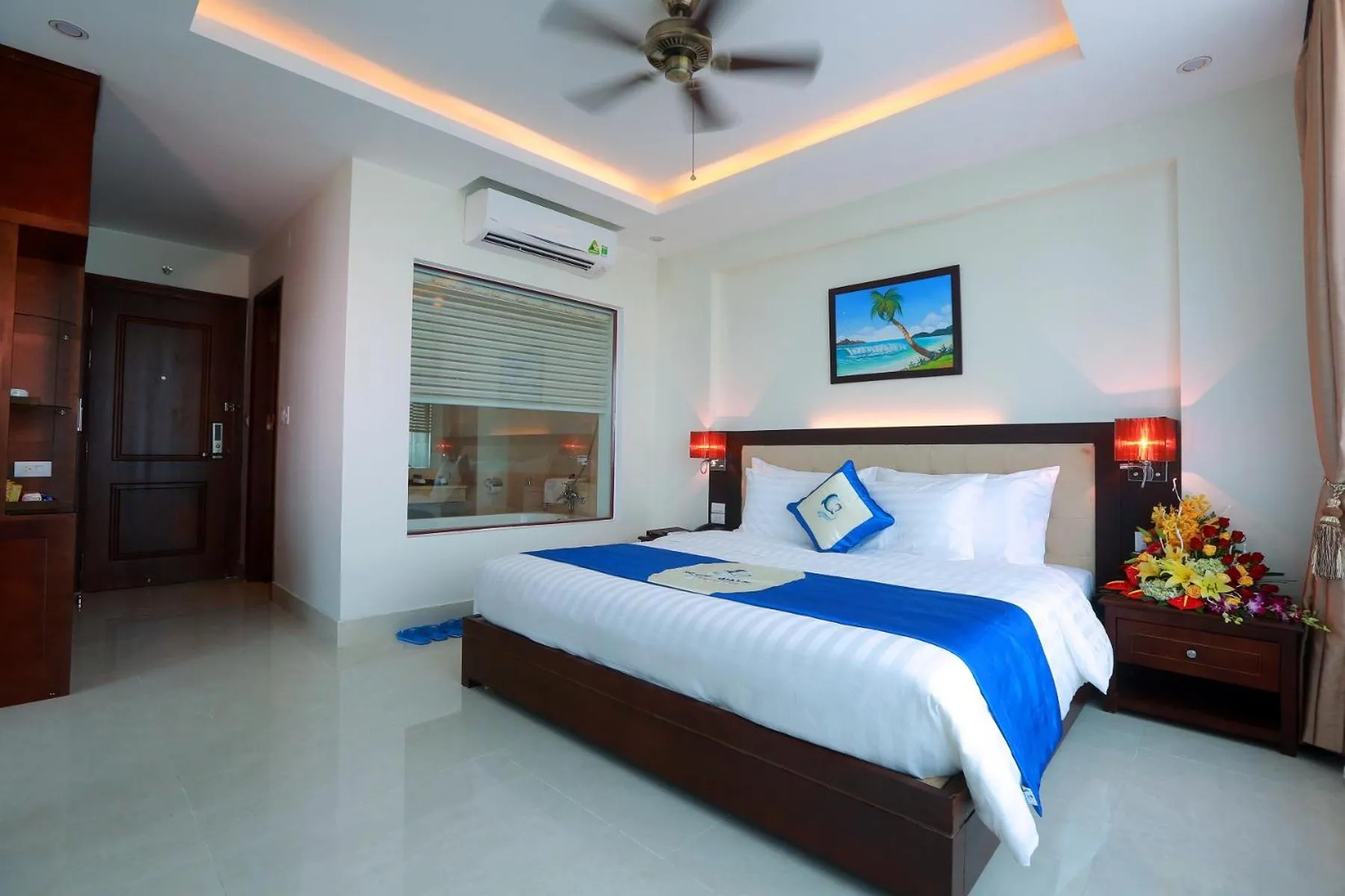 Bed in Blue Wave Hotel