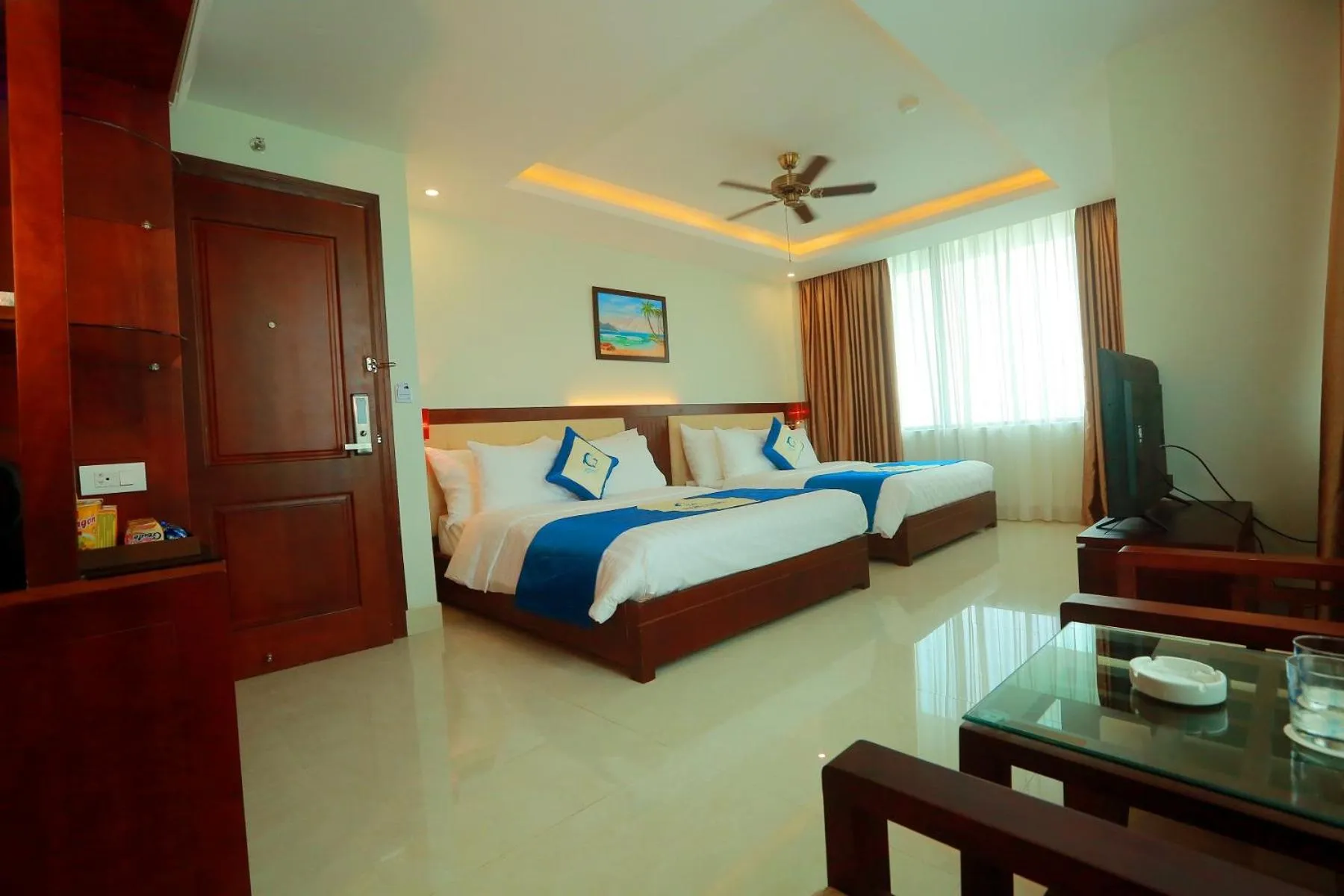 Bed in Blue Wave Hotel