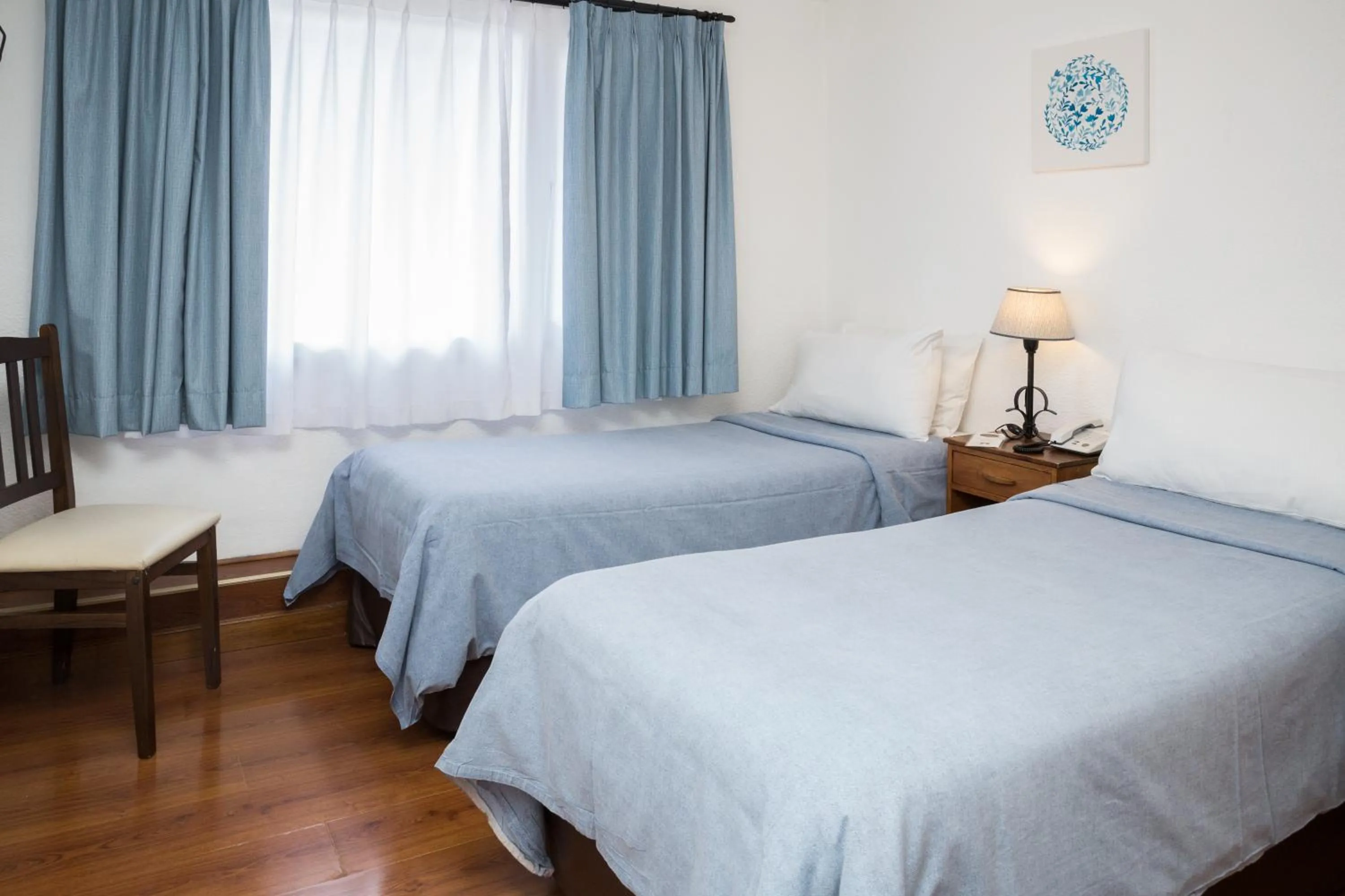 Bed in NBH Premier Hotel