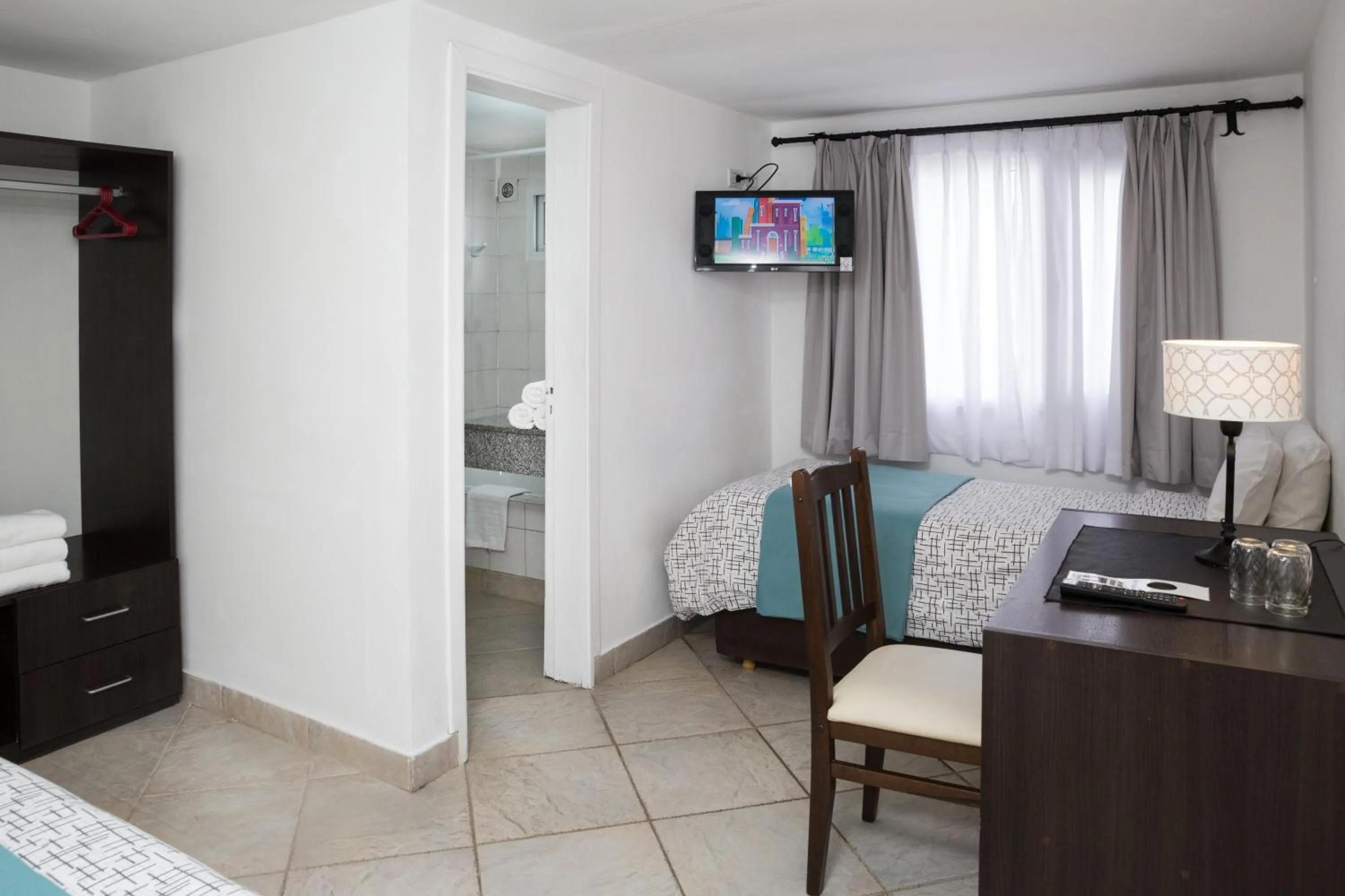 Bed in NBH Premier Hotel