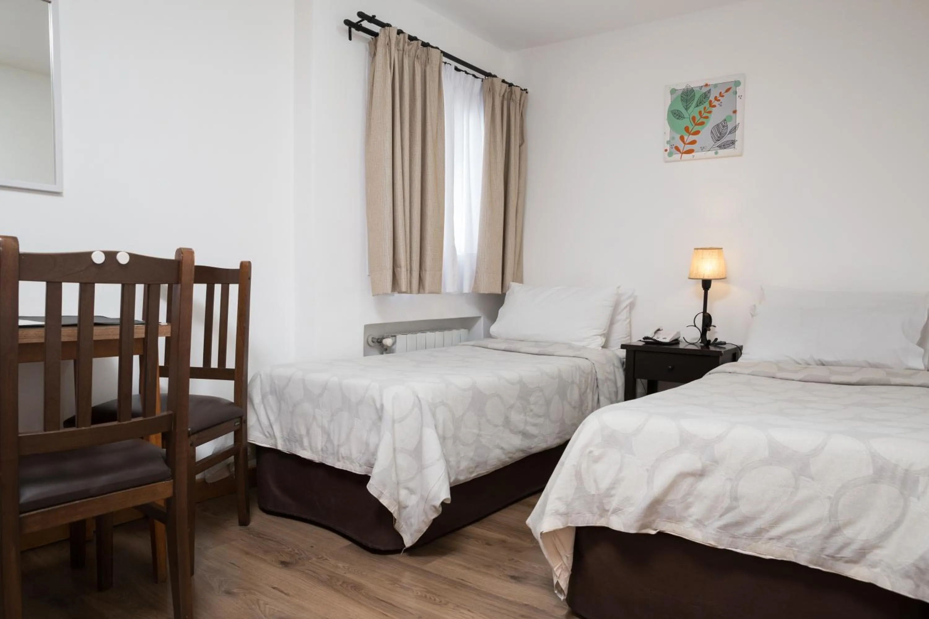 Bed in NBH Premier Hotel