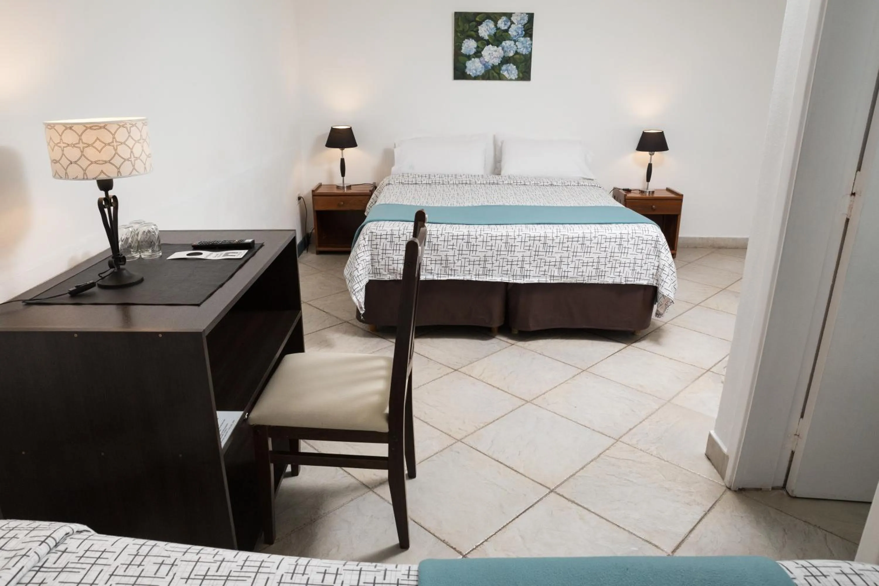 Bed in NBH Premier Hotel