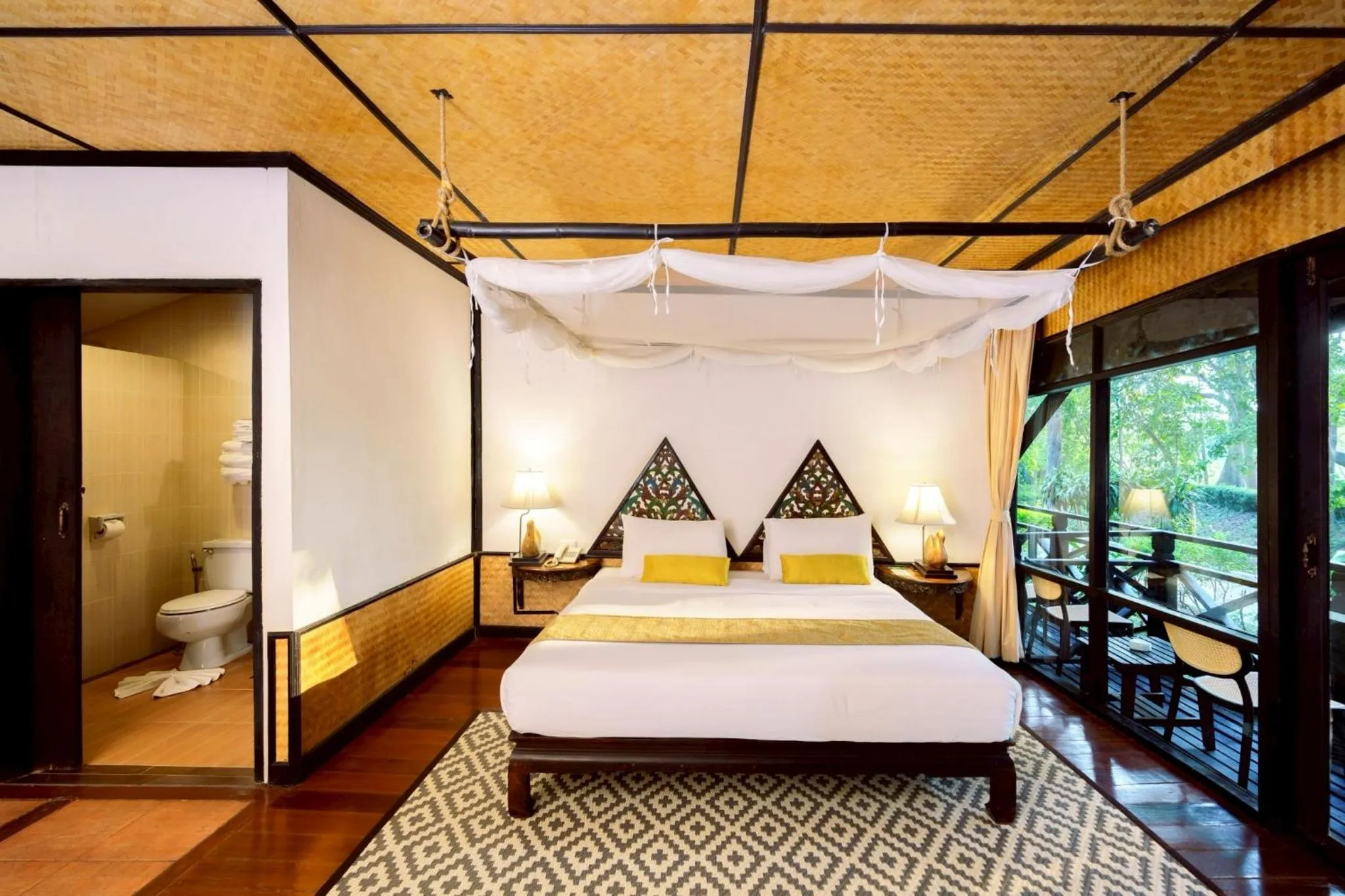 Bed in Lampang River Lodge