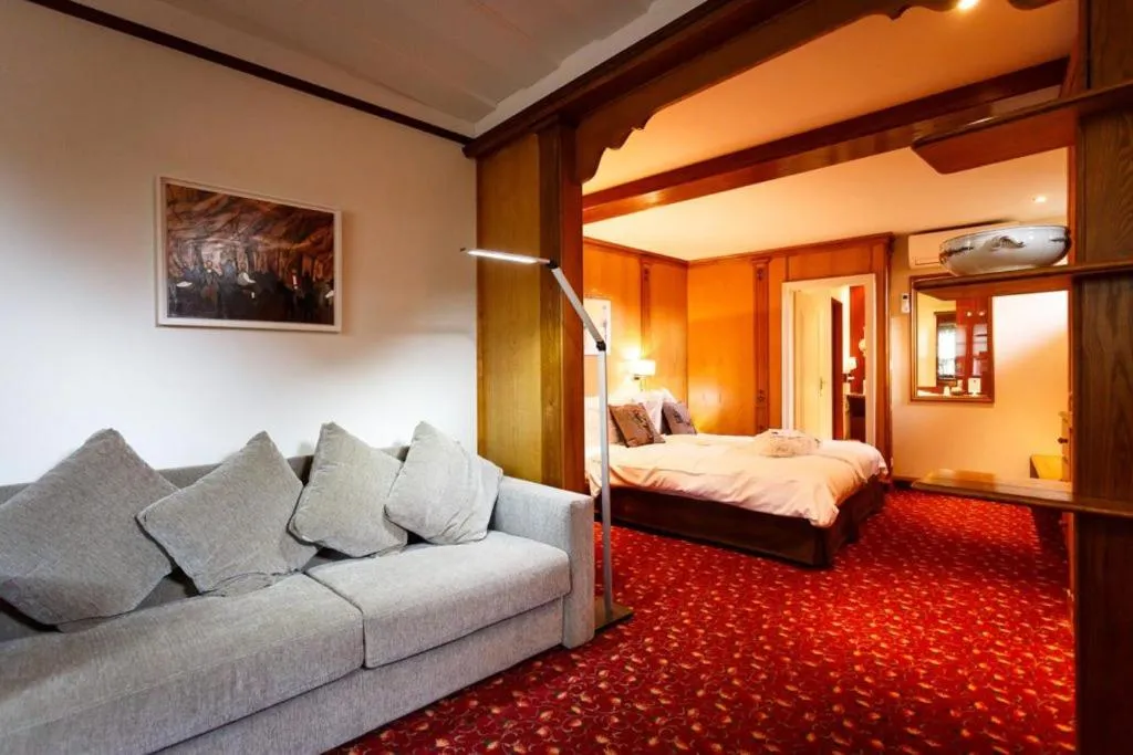 Seating area, Bed in Hotel - Restaurant Le Cerf & Spa