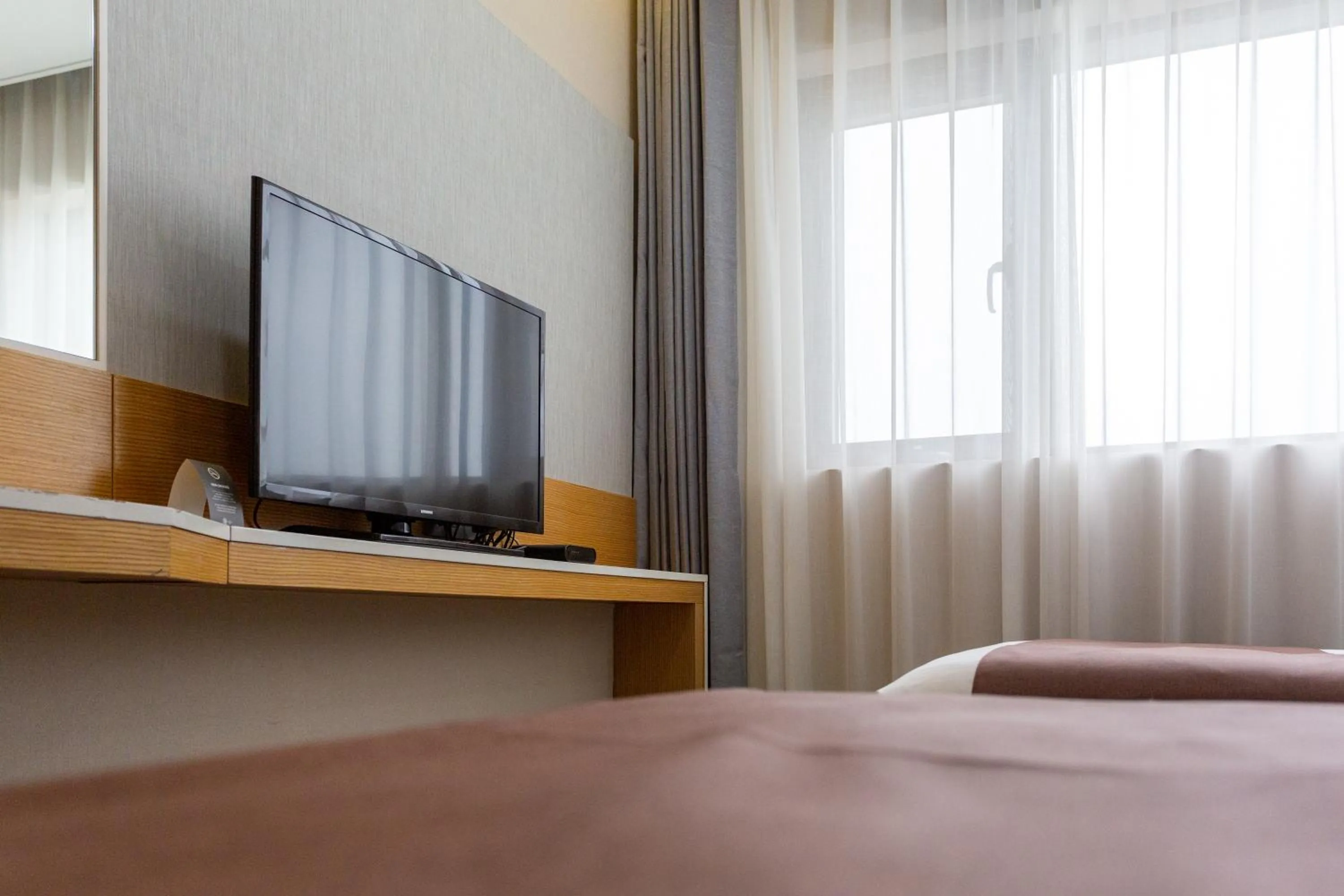 Bed in The Recenz Dongdaemun Hotel