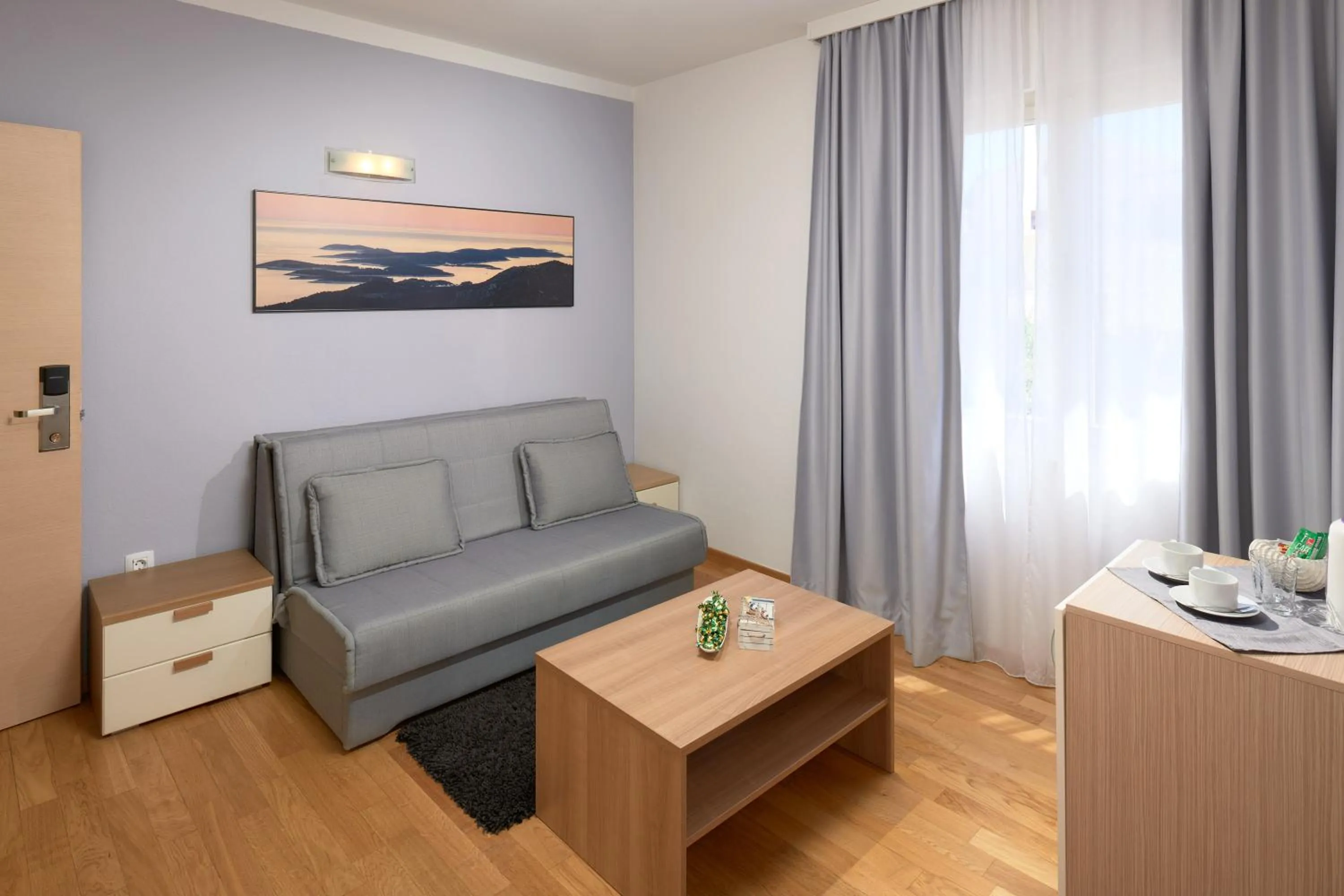 Seating area, Bed in Hotel Fortuna