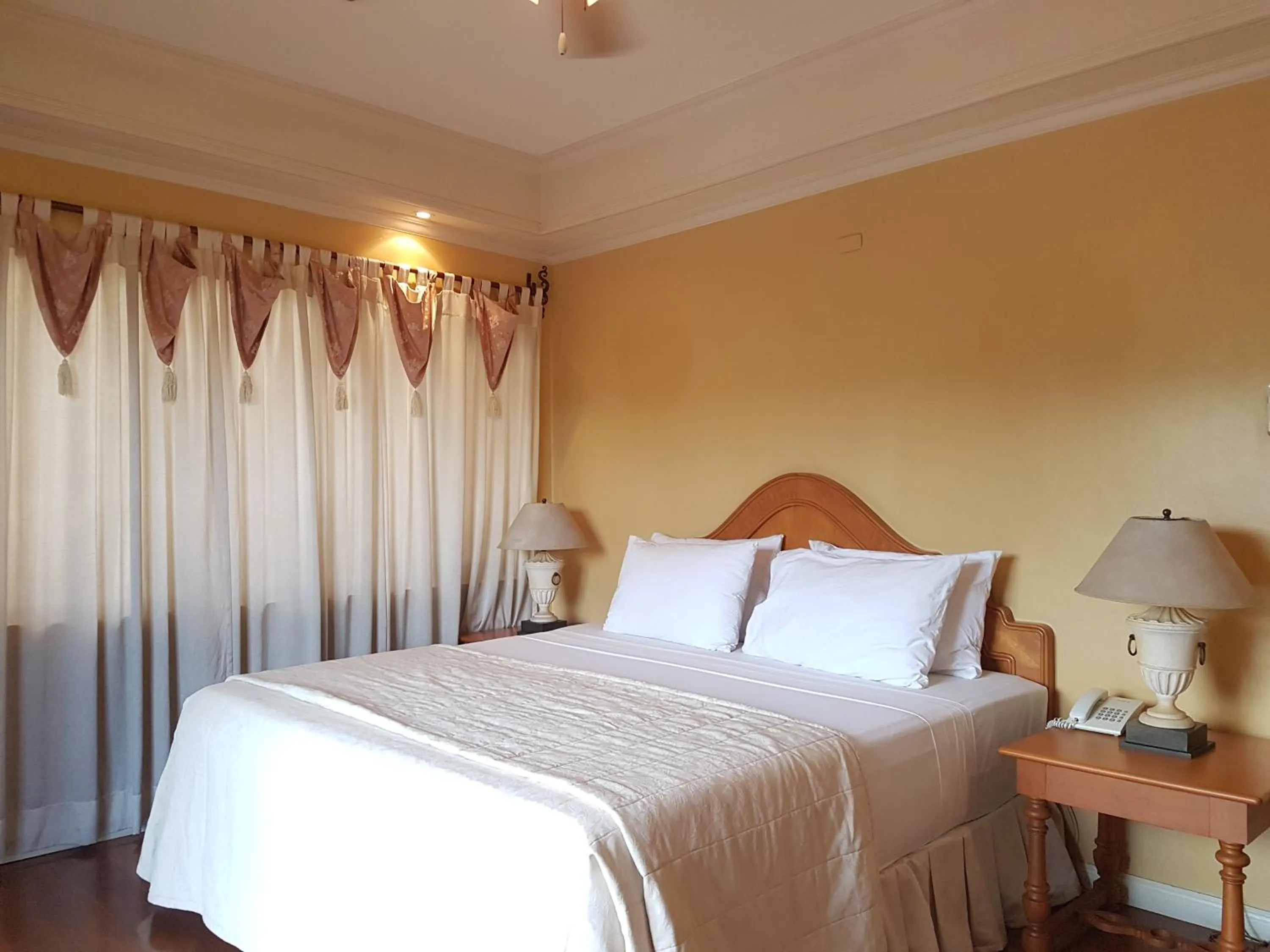 Bed in Sophia Suites Residence Hotel