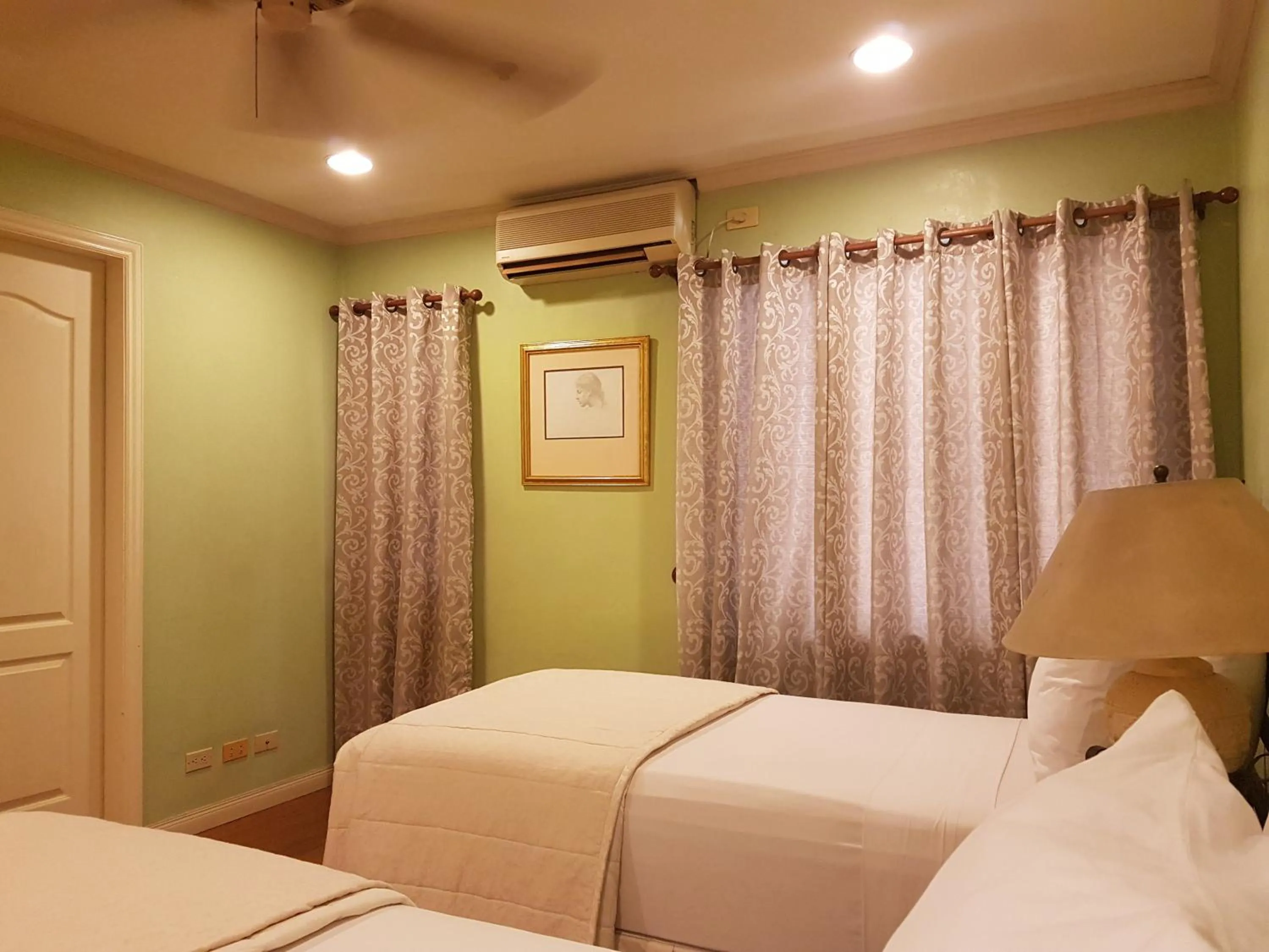 Bed in Sophia Suites Residence Hotel