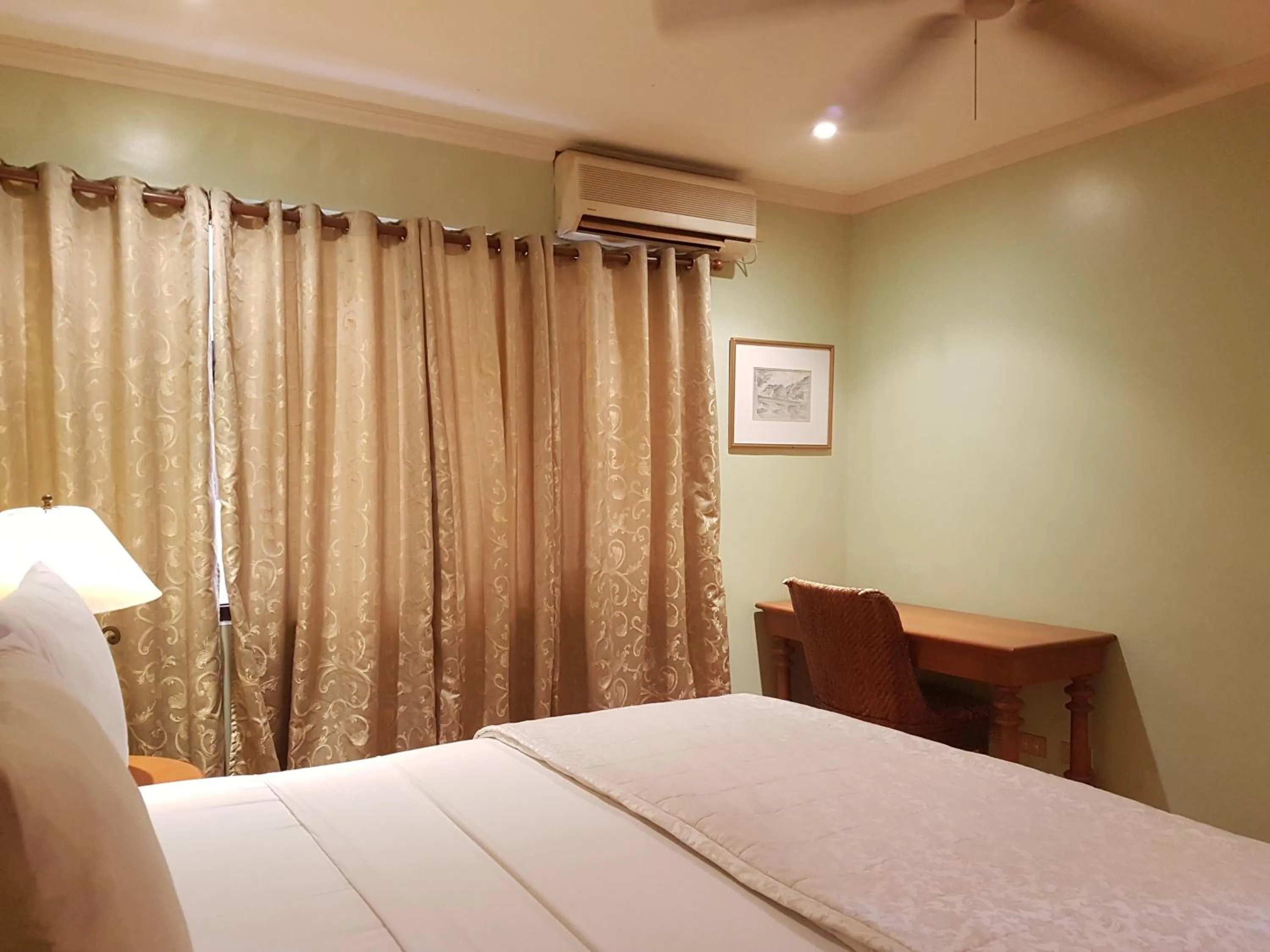 Bed in Sophia Suites Residence Hotel