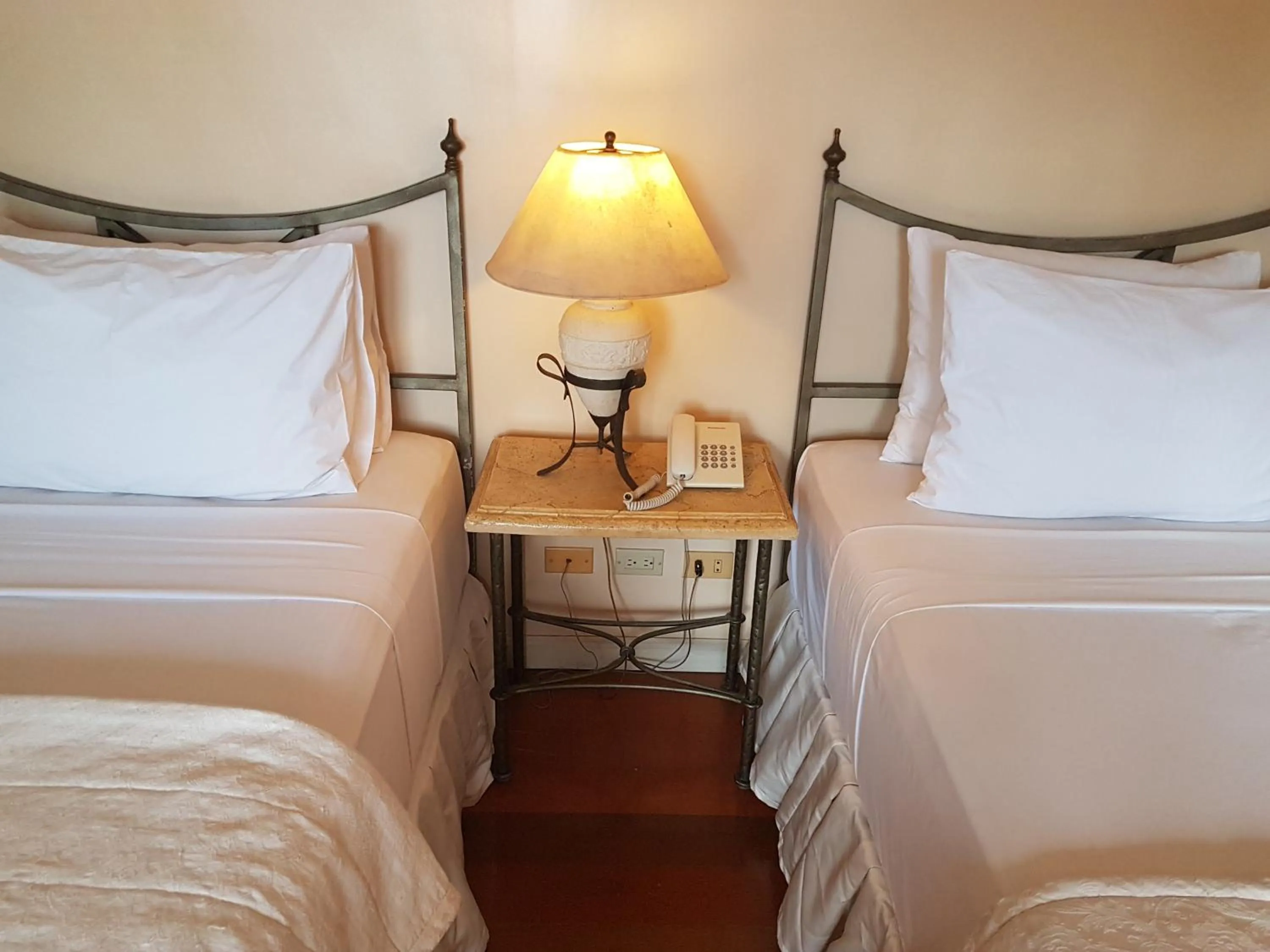 Bed in Sophia Suites Residence Hotel