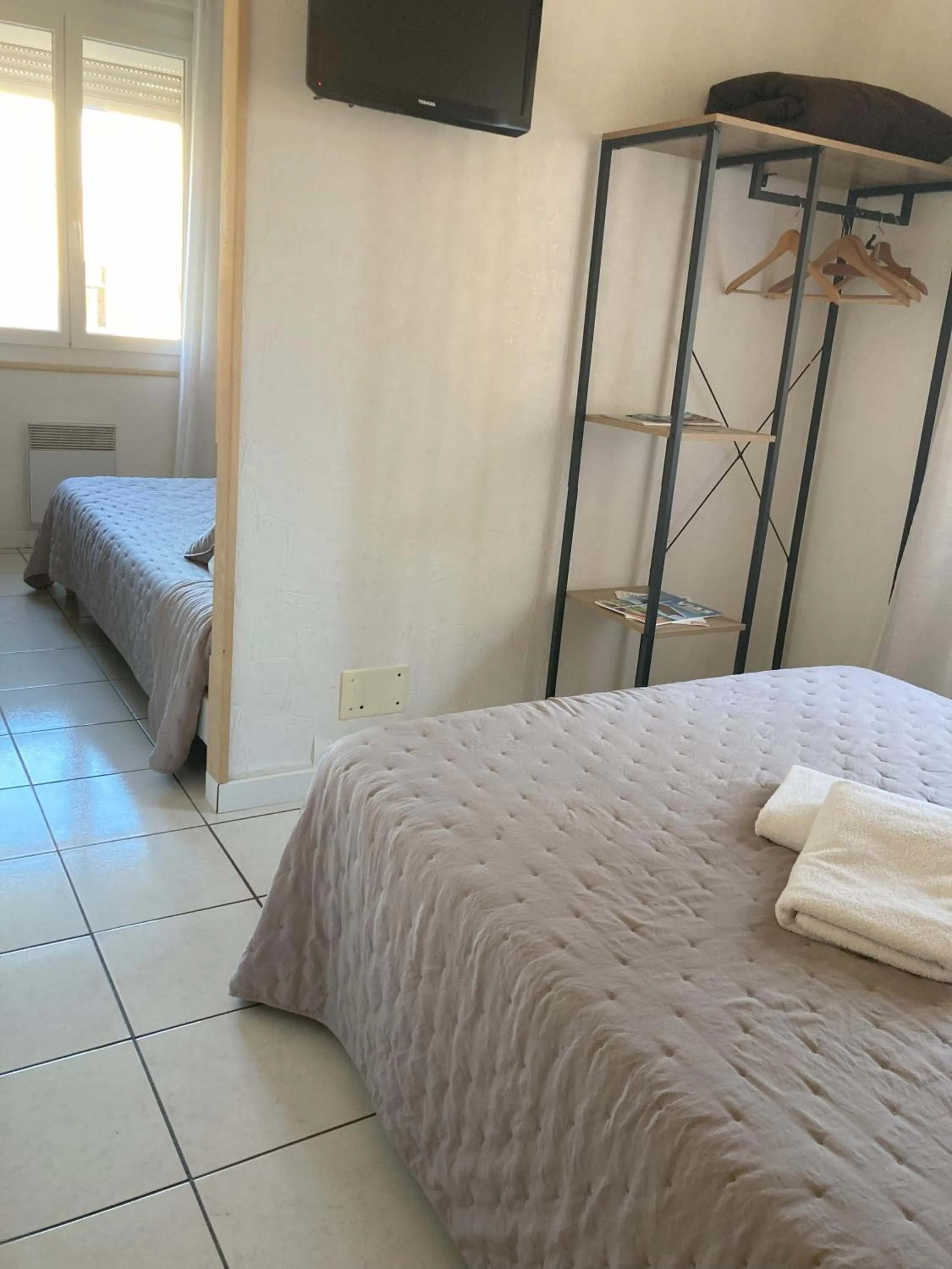 Photo of the whole room, Bed in Hôtel Le Gambetta